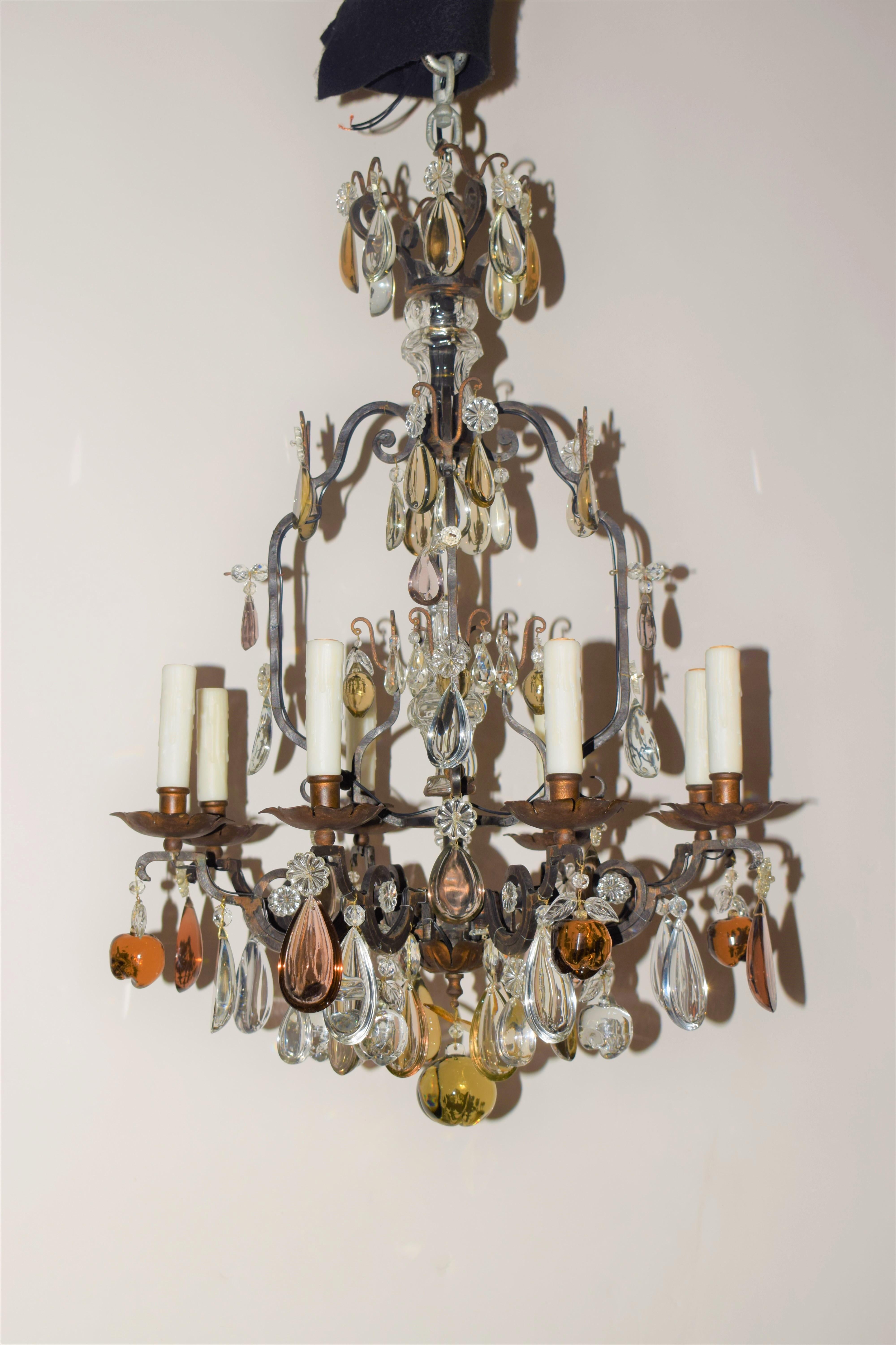 A very fine Louis XV style iron chandelier featuring hand cut Crystal Pendalogues & Fruits. France, circa 1900. 8 Lights.
Dimensions: height 33