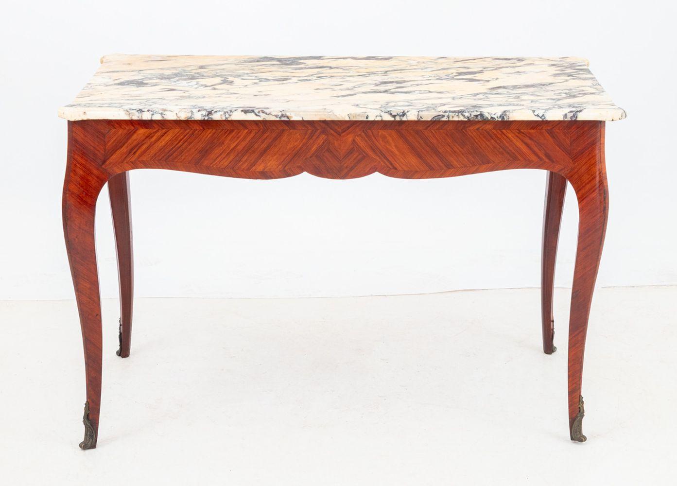 Louis XV Style Kingwood and Marble Top Desk, early 20th century, the rectangular molded marble top above a plain frieze, fitted with end drawers, on cabriole legs with gilt metal scrolled feet. 28