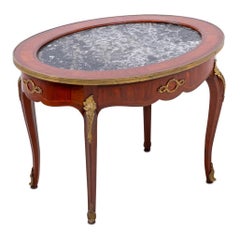 Table basse ovale en bois de roi et marbre de style Louis XV