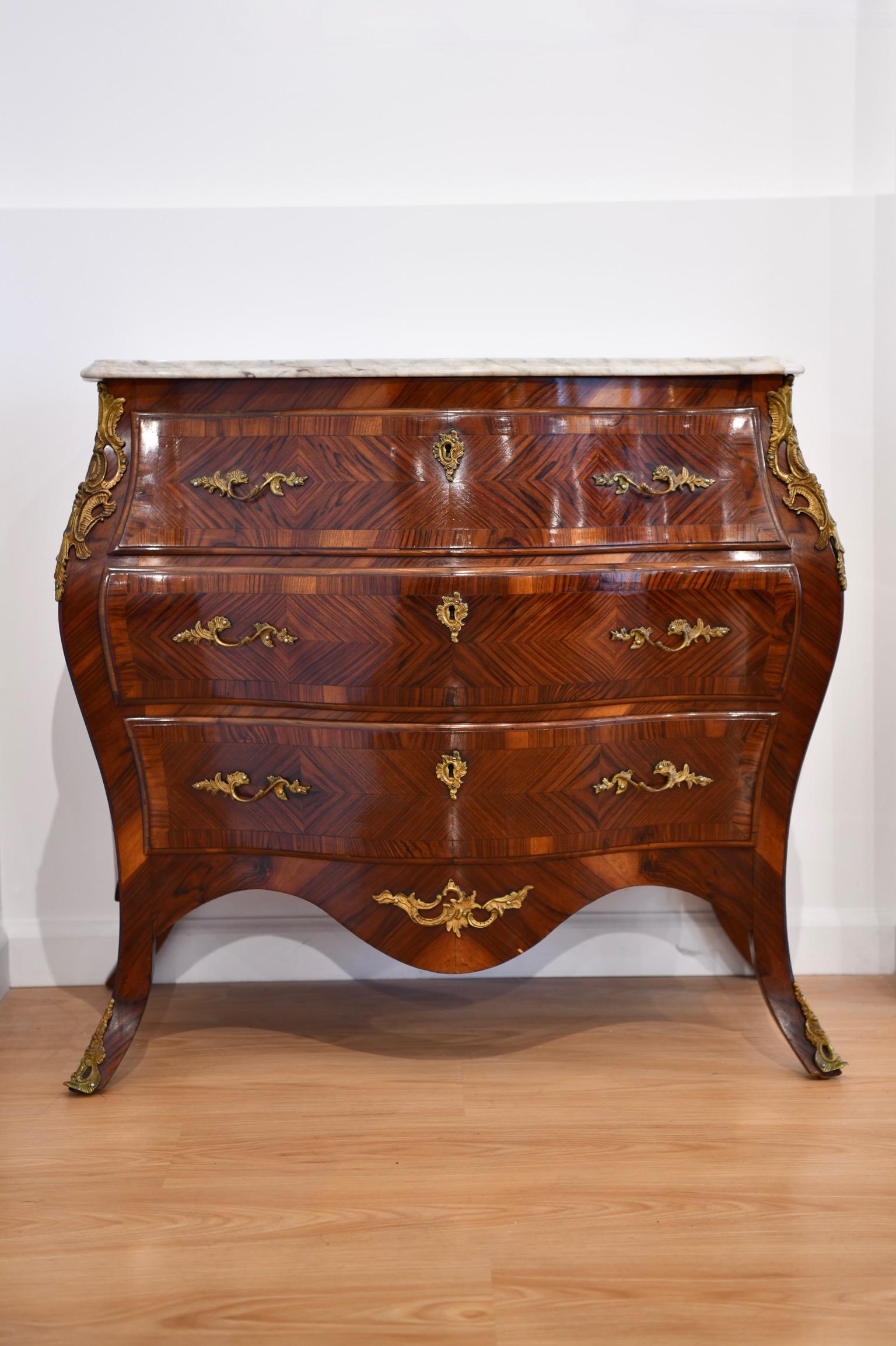 Rare Louis XV style bronze mounted marble top and kingwood bombe commode. Some surface level imperfections and scratches to marble, pictured; otherwise, in good condition. Two available, sold individually. Dimensions: 32