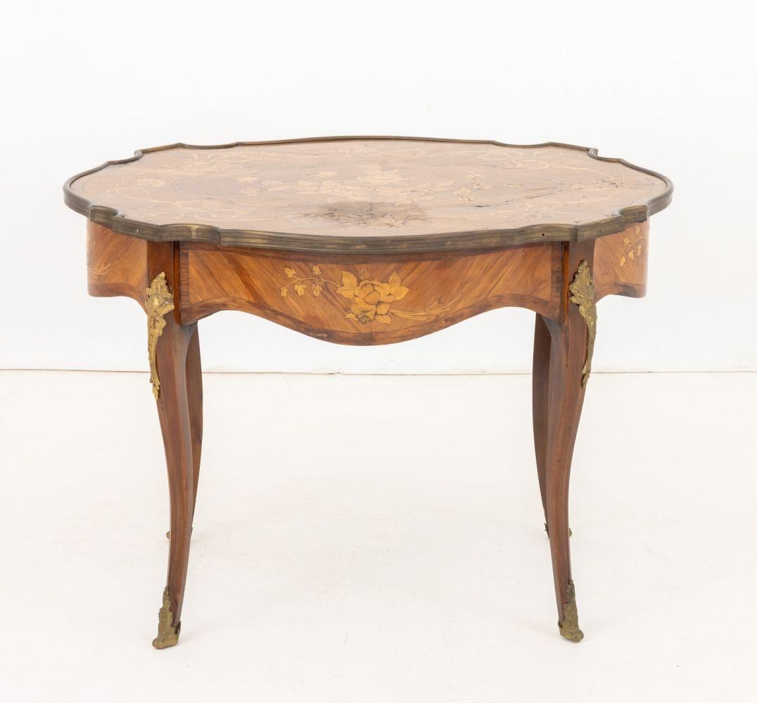 Louis XV Style Kingwood Marquetry Coffee Table, the  inlaid top with ormolu mounted rim above four cabriole legs with ormolu mounts and tips. 28