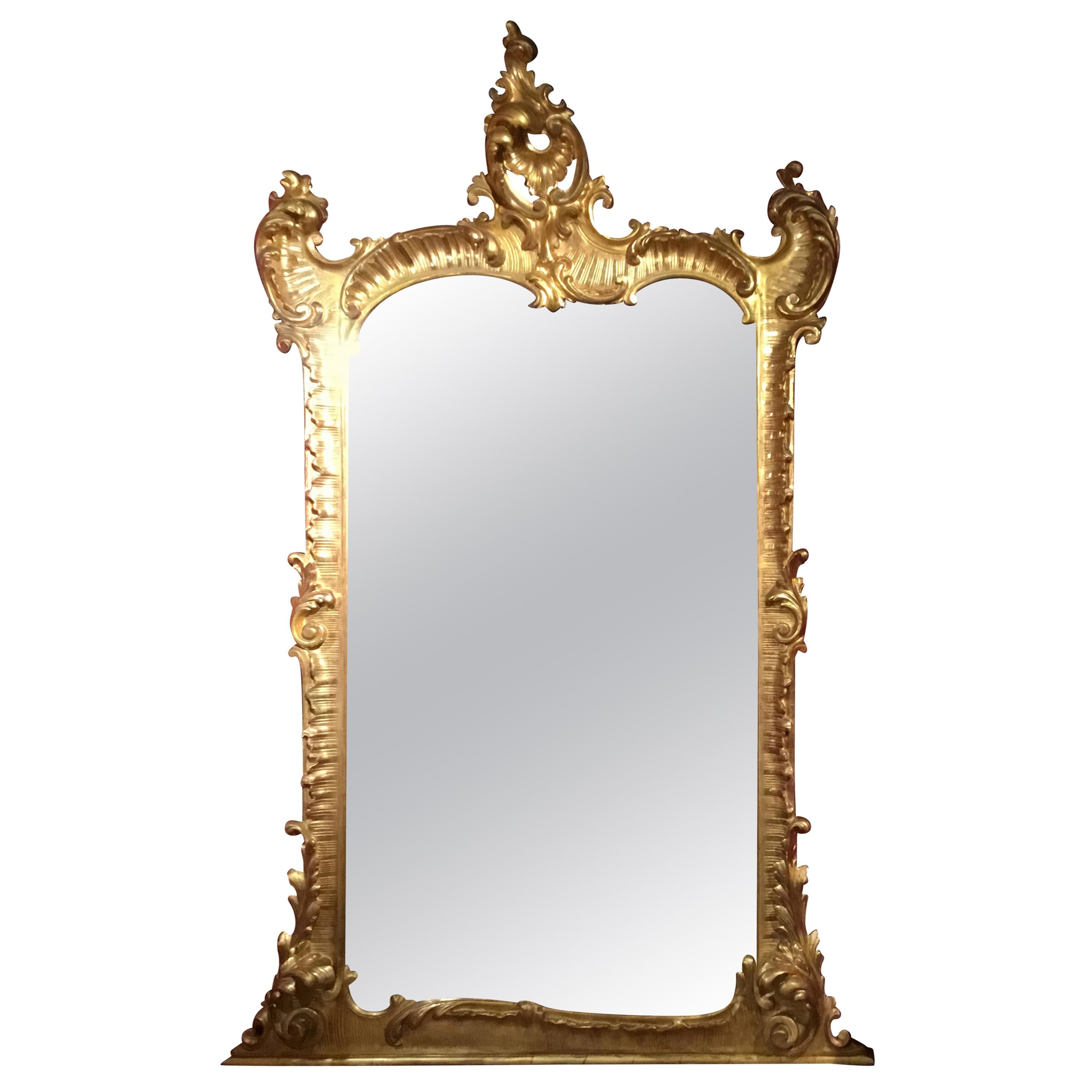 Louis XV-Style large giltwood mirror with impressive carving