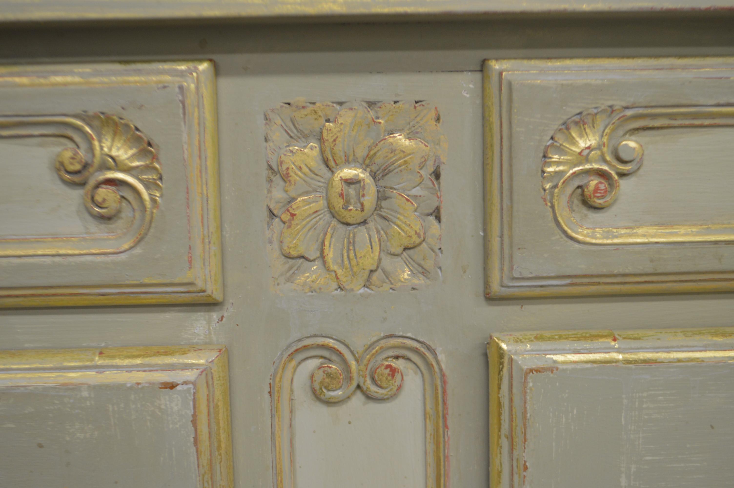 Exquisite fine distressed paint finish on the Louis XV style buffet with rounded sides.
There are four drawers and storage compartments.
The interior is very well finished with gilded edges.
The cabinet has been painted over solid cherrywood.