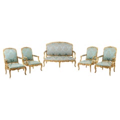 Louis XV style living room with gilded wood frame. Circa 1880.