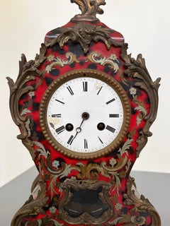 Louis XV-style mantel clock made of faux tortoiseshell, with a Kienzle label