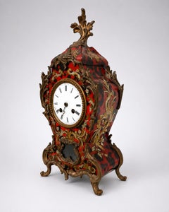 Louis XV-style mantel clock made of faux tortoiseshell, with a Kienzle label