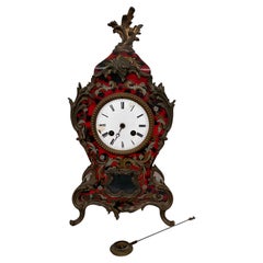 Louis XV-style mantel clock made of faux tortoiseshell, with a Kienzle label
