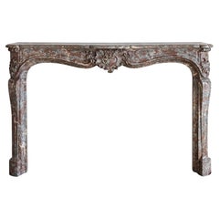 Louis XV style mantel in Rouge Royal marble, 18th century
