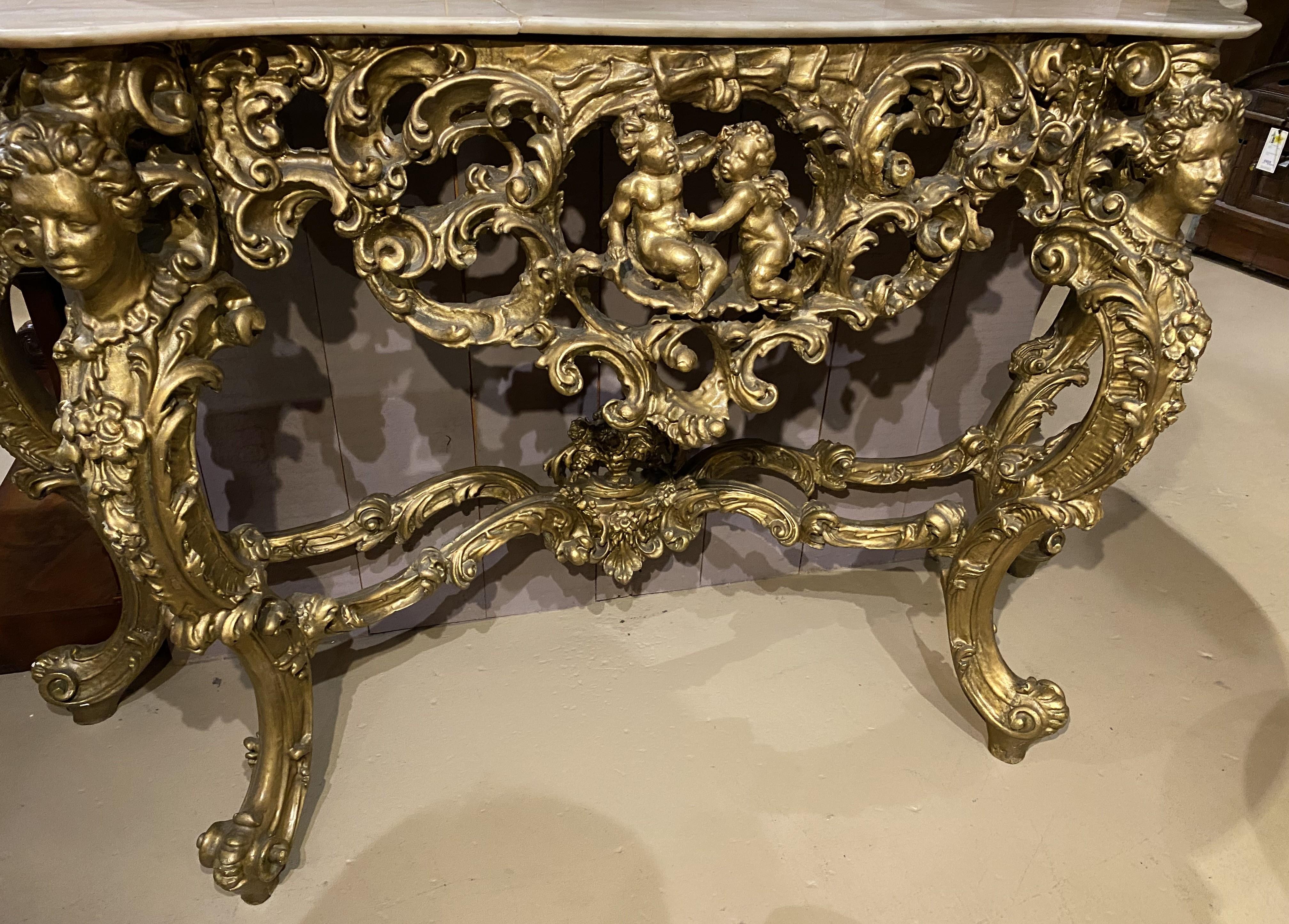 Hand-Carved Louis XV Style Marble Top Carved Giltwood Console w/ Cherub & Figural Decoration For Sale