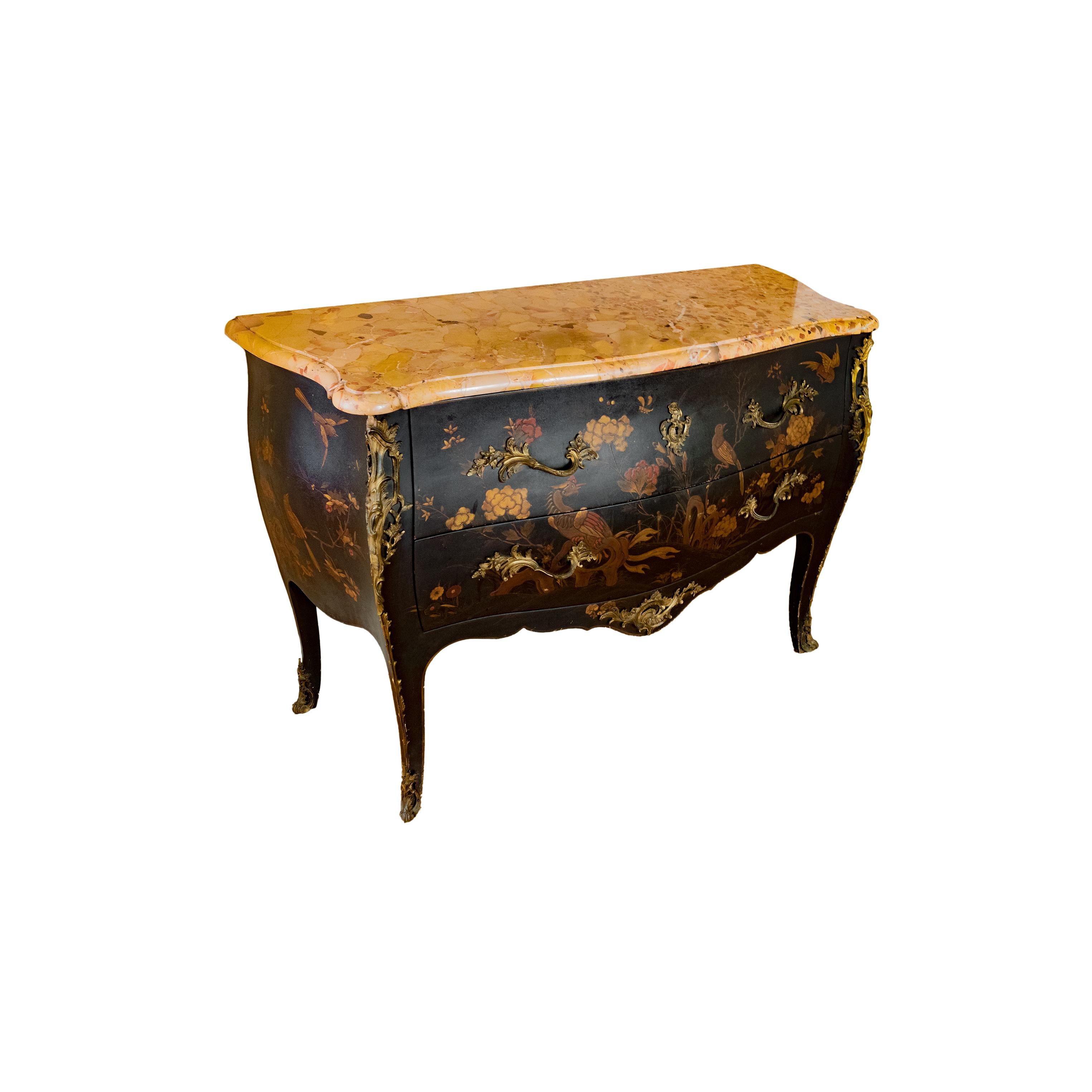 Chinese lacquer commode, chased and gilded bronze with Aleppo breccia marble top, with a frame of plain black Martin veneer.
Beautiful ornamentation of finely chiseled and gilded bronzes including angle drops, foot
slippers, lamp base and keyholes.