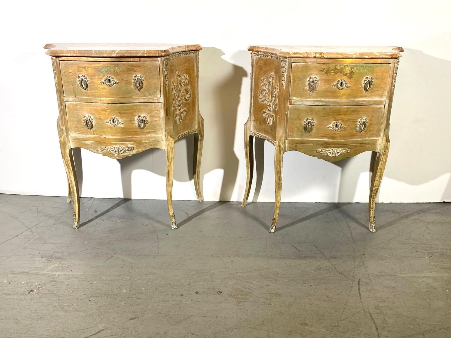 Italian Louis xv style marble top nightstands. Two drawers with brass pulls.
