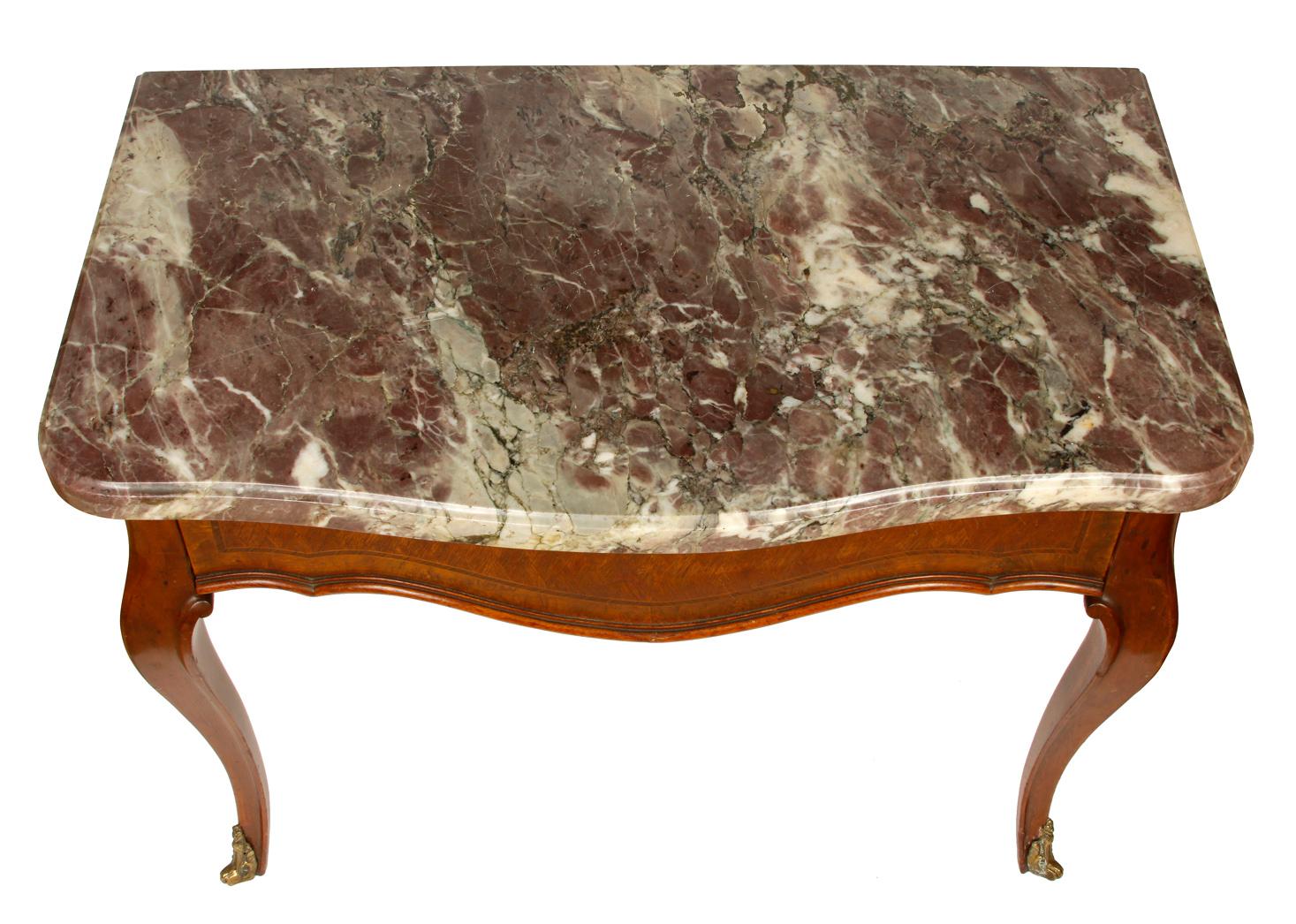 Louis XV style dark rose marble-top table with one drawer and brass details on feet and corners. Measures: 30.75 inches wide x 17.5 inches deep x 24 inches high.