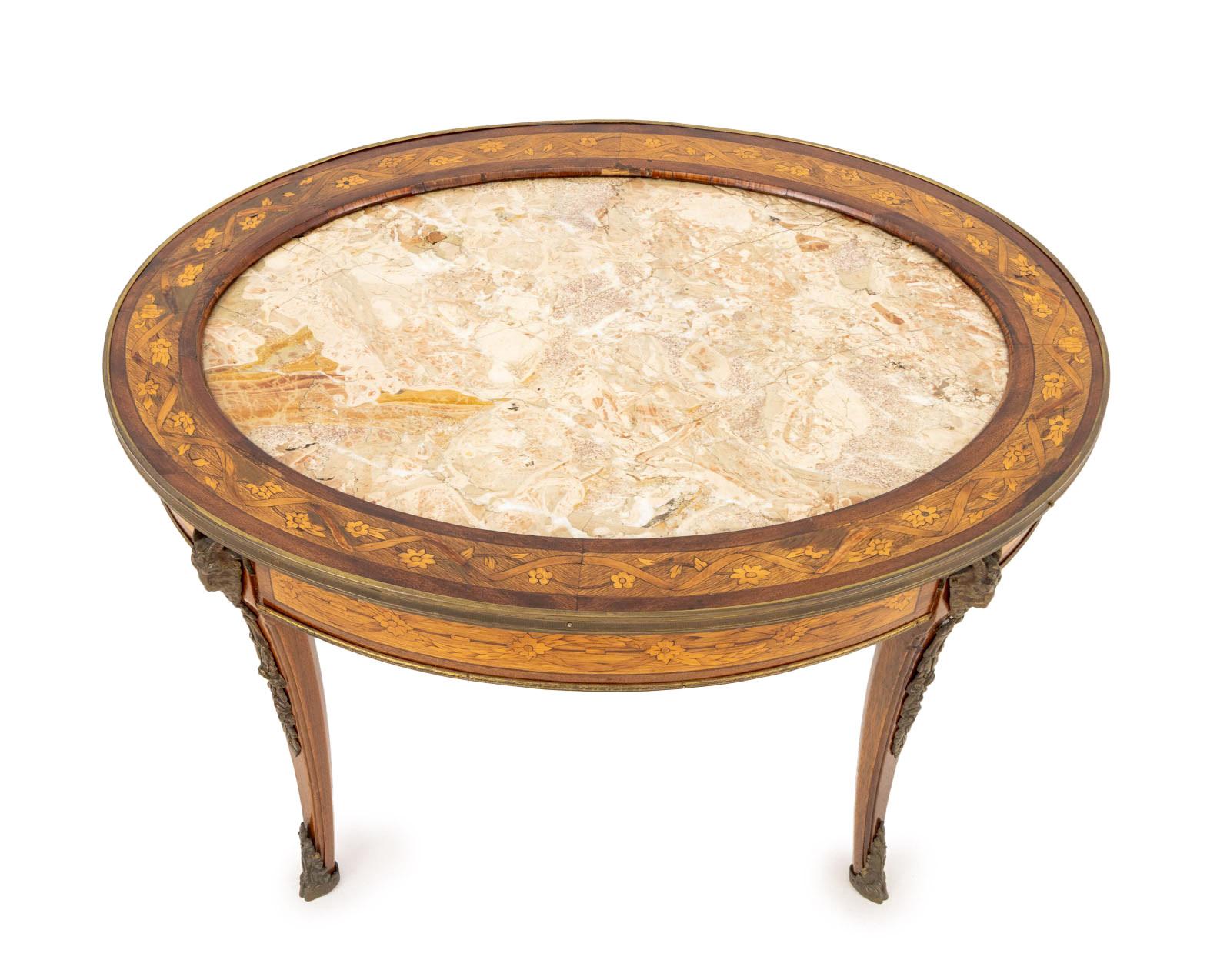 Louis XV Style Marble Top Walnut Marquetry Oval Coffee Table, the inset breccia aurora marble top framed by floral and ribbon marquetry with ormolu mounted rim and accents on four cabriole legs. 20.5