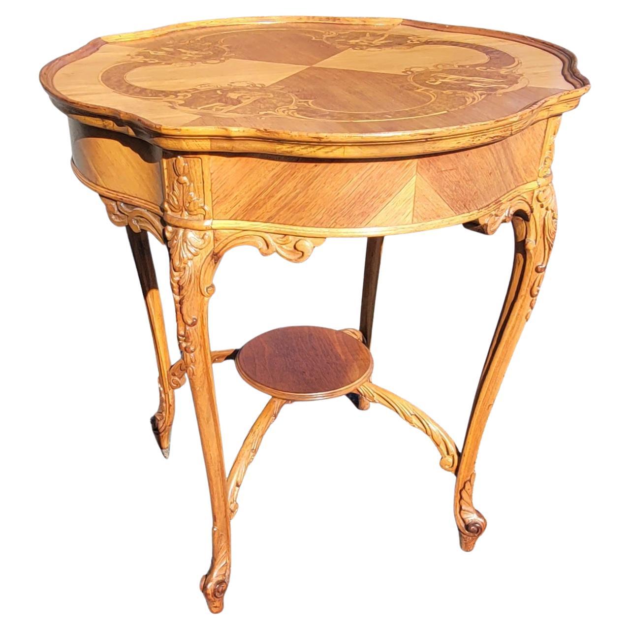 Louis XV style Marquetry and carved walnut and mahogany center table with stretcher for greater stability. Intricate marquetry works on top featuring 4 dancing couples individually designed and inlaid, apron and carvings on cabriole legs terminating