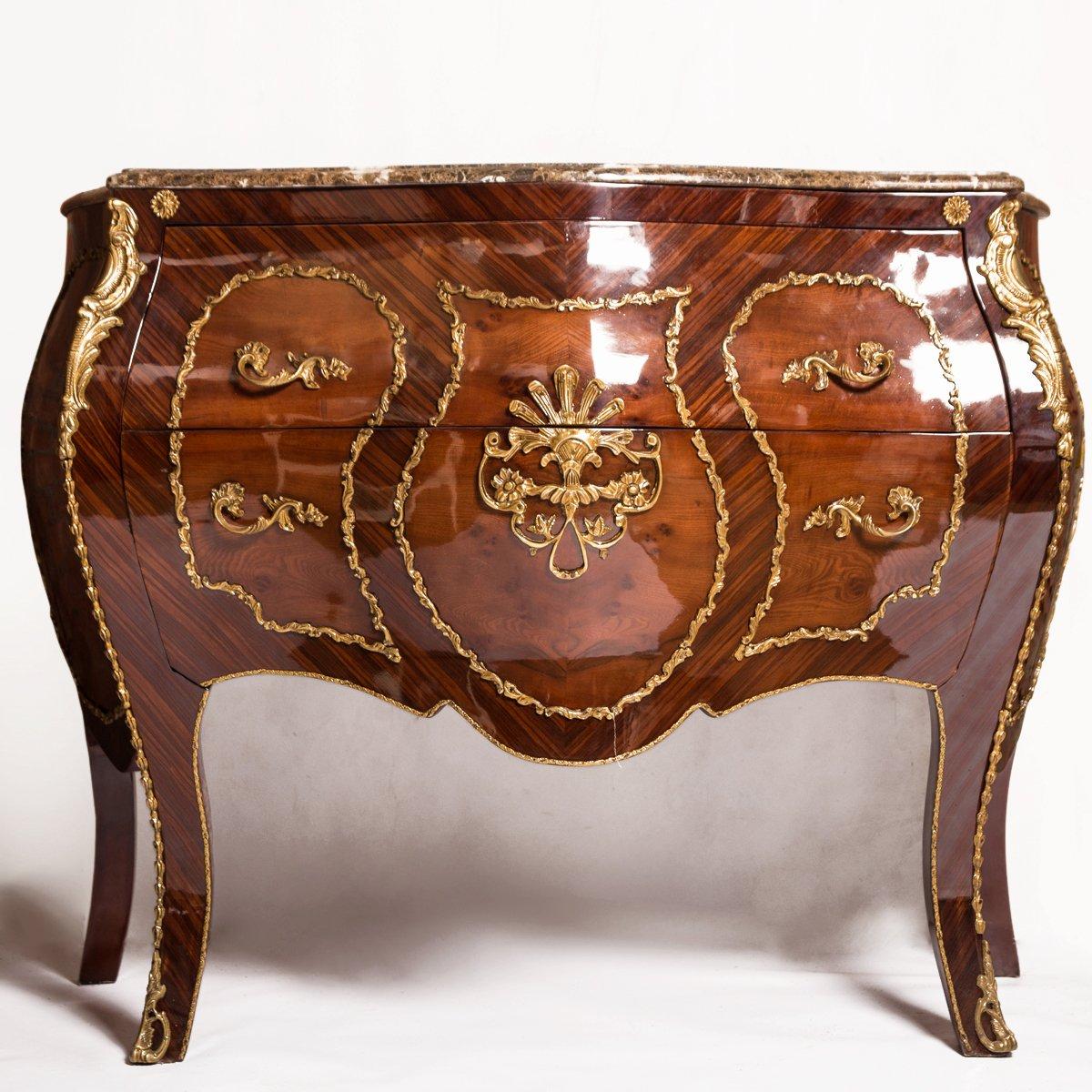 A beautiful Louis XV Style Marquetry Inlaid Bombe Commode 20th century. 

The Louis XV Style Marquetry Inlaid Bombe Commode is inspired by Louis XV French style which is characterized by its elegance, lightness and harmony of lines. It is made of