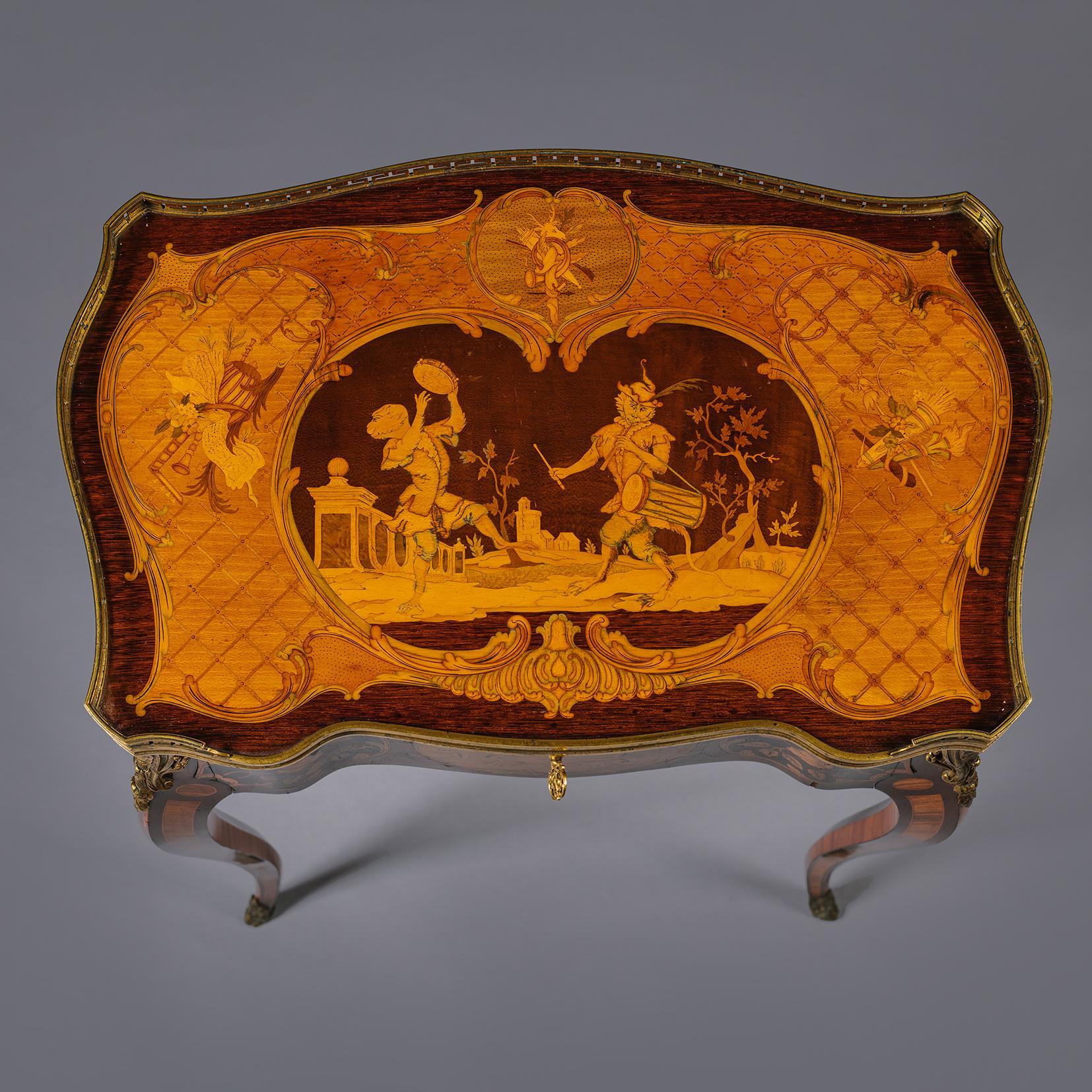 
A Fine and Rare Louis XV Style Gilt-Bronze Mounted Marquetry Occasional Table. By Emmanuel Alfred (dit Alfred II) Beurdeley. Paris. France, Circa 1885.

The top with marquetry of precious fruitwoods and rare timbers depicting a central cartouche of