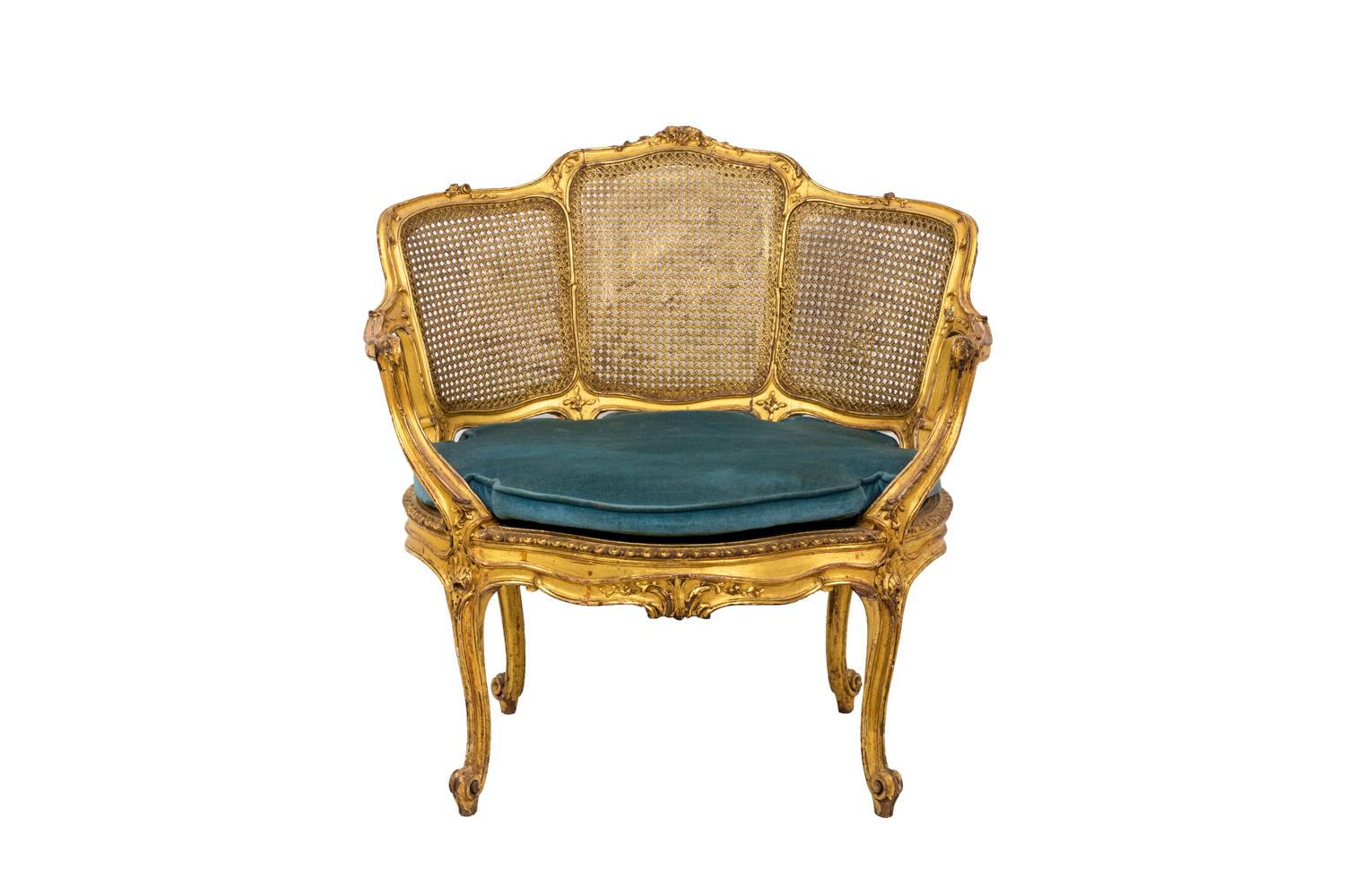 Little Louis XV style marquise armchair standing on four cabriole legs finished by scrolls. Shell decorated apron. Caned back in three sections decorated with flowers and shell. Arm support on the leg line adorned with acanthus leaves. Wide seat