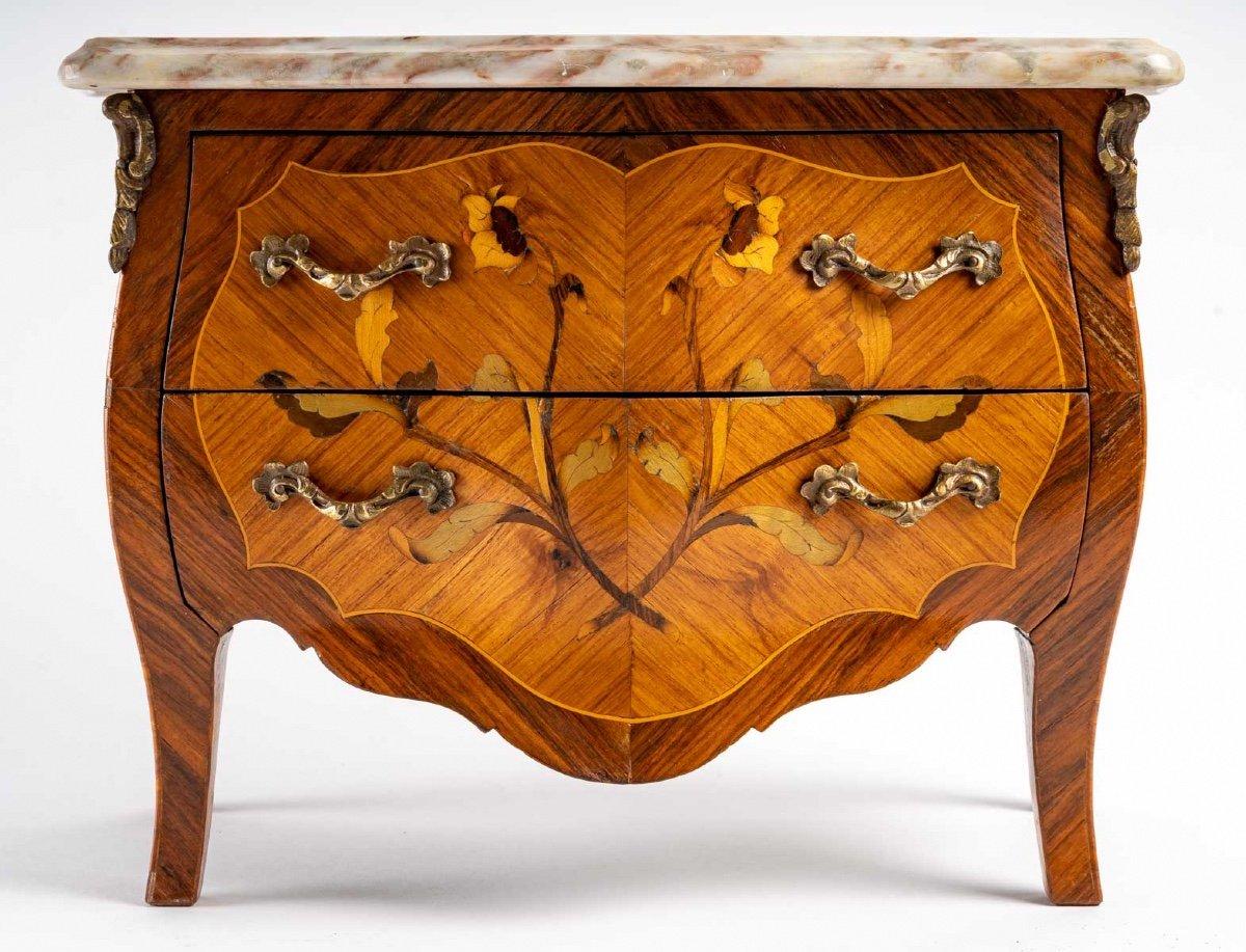 Louis XV style miniature chest of drawers with two drawers
with bronze ornaments
Headed by a veined marble top, late 19th century 
In perfect condition
Material: veneer and marquetry, bronze ornamentation
width: 34 cm
height: 24 cm
depth: 18