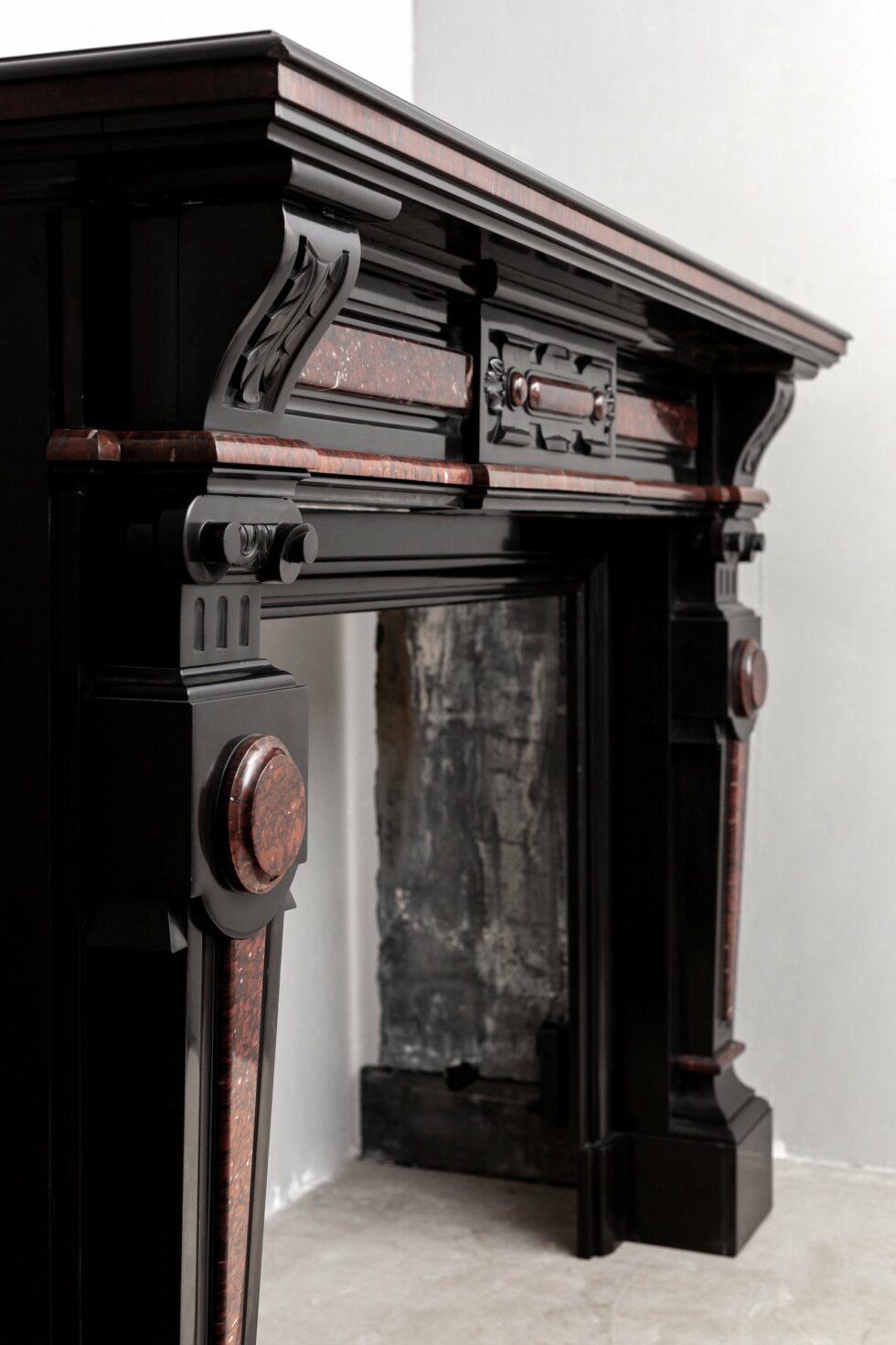 Hand-Carved Louis XV Style Noir De Mazy Antique Fireplace For Sale
