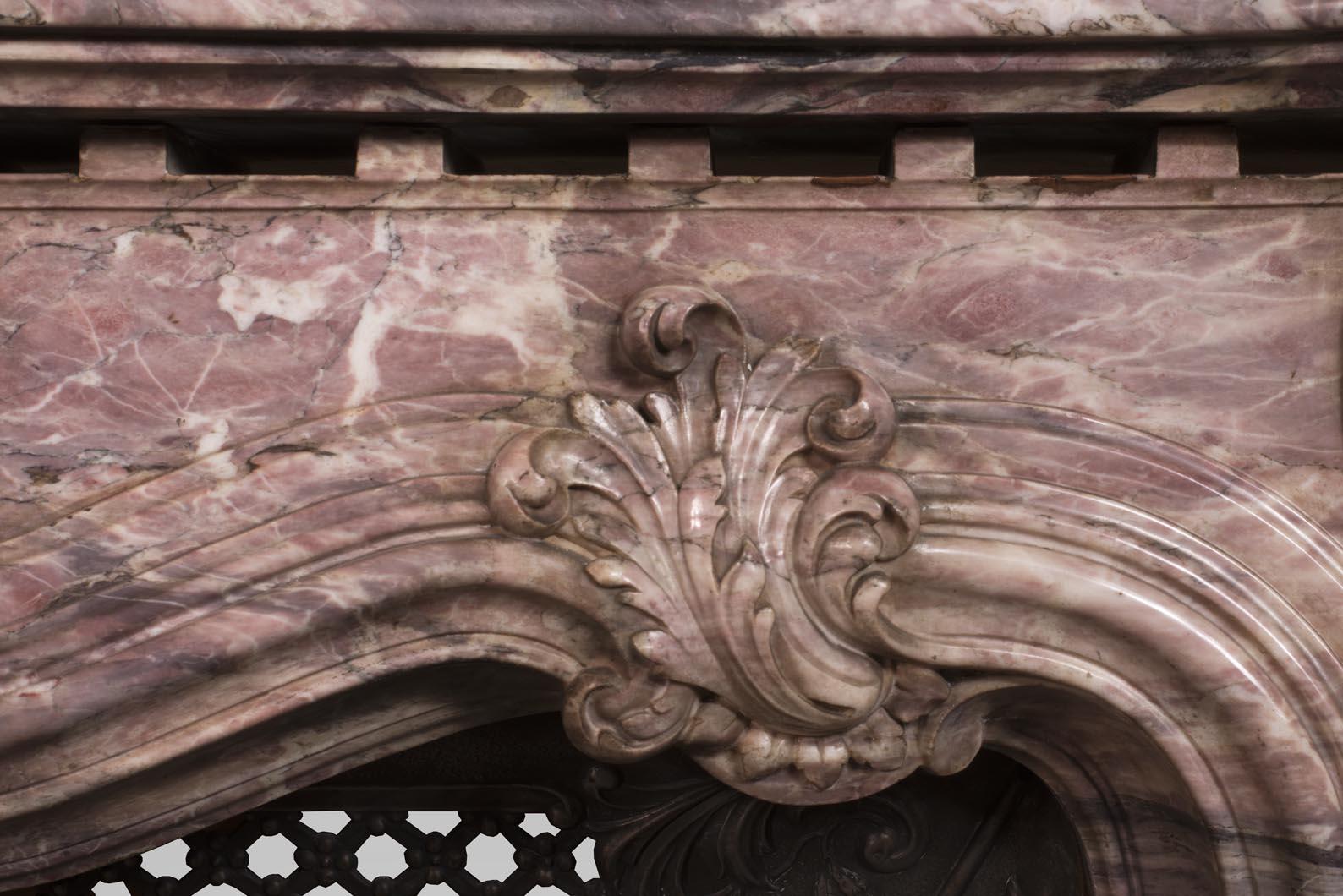Louis XV style opulent fireplace sculpted out of Fleur de Pêcher marble For Sale 2