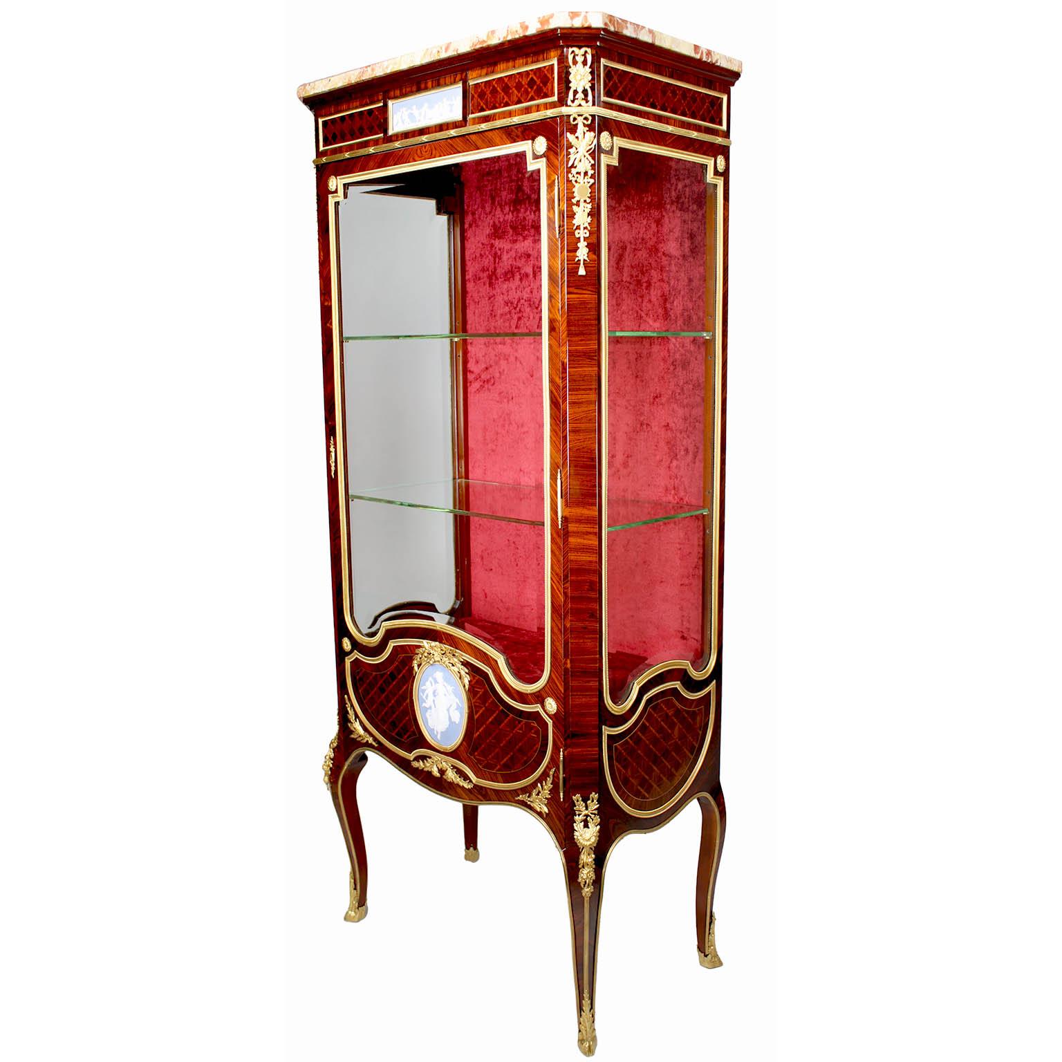 A Very Fine French 19th-20th Century Louis XV Style Ormolu and Jasperware-Mounted Rosewood, Mahogany and Kingwood Single Door Vitrine, possibly by François Linke (1855-1946). The upper front apron centered with an allegorical Jasperware plaque