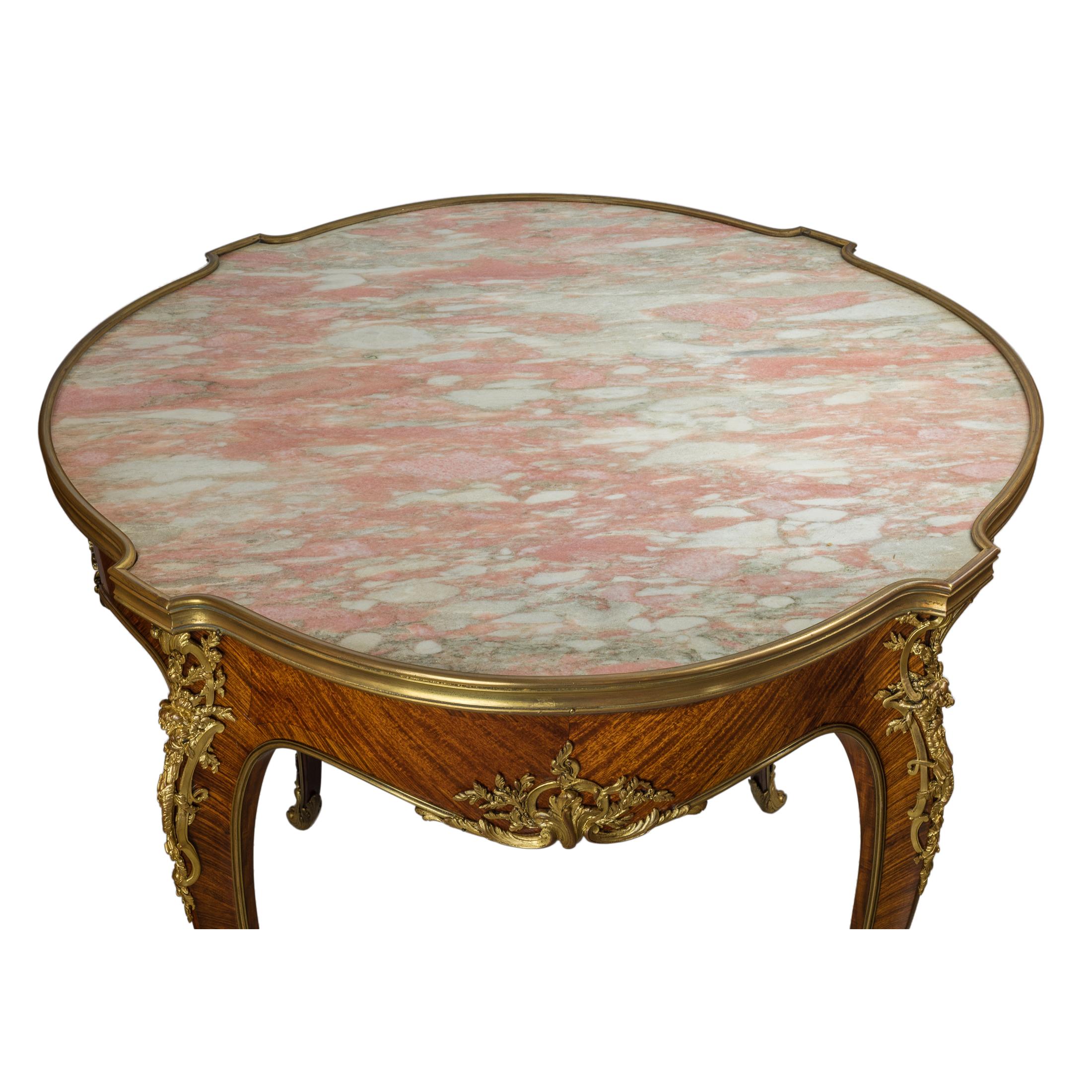 A very desirable Louis XV- style ormolu-mounted kingwood satiné circular center table with white and pink marble top

Maker: Joseph-Emmanuel Zwiener (French, 1848-1895)
Date: circa 1875-1900
Dimension: Height 29 in.; diameter 32 ¼ in.