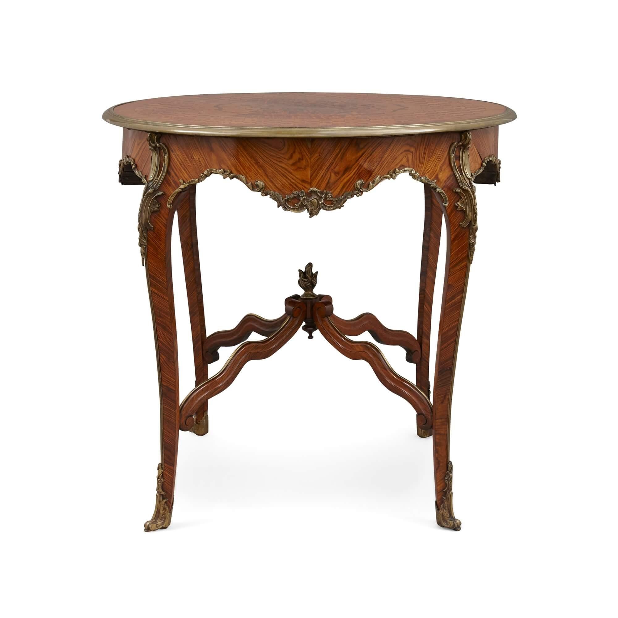 Louis XV style gilt bronze and parquetry circular centre table
French, 19th Century,
Height 77cm, Diameter 85cm

Made in France in the 19th century, this excellent table is in the rich Louis XV style, and is replete with gilt-bronze mounts and