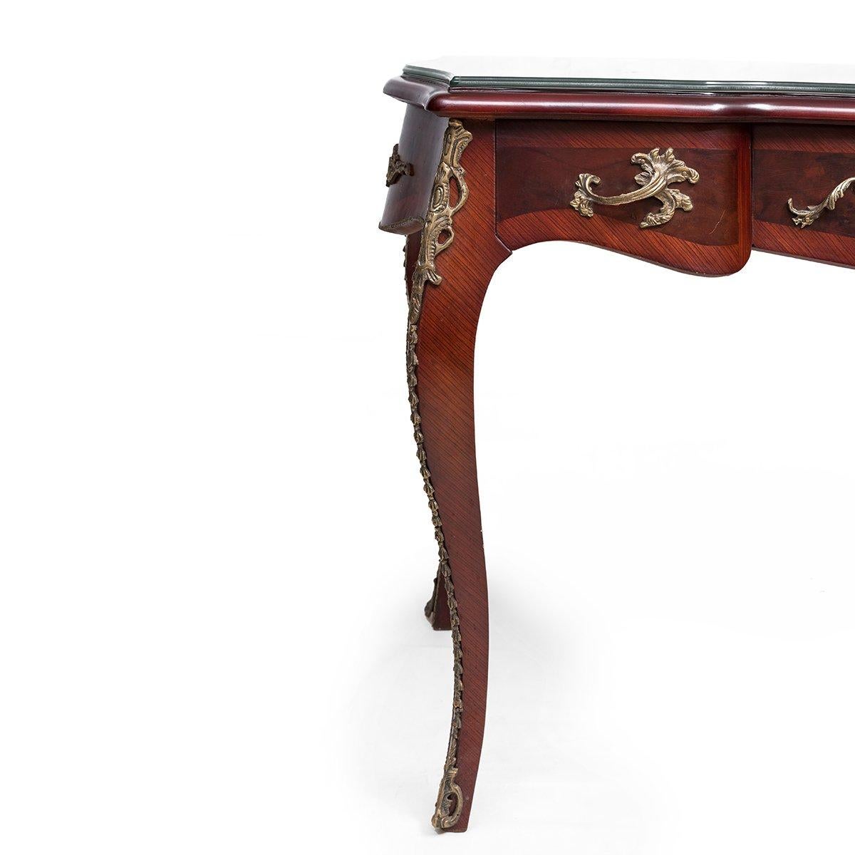 A gorgeous Louis XV style ormolu-mounted writing desk-bureau plat, 20th century.

Handmade Louis XV style ormolu-mounted writing desk is fully made of natural beechwood. It is inspired by the Louis XV furniture style which is characterized by its