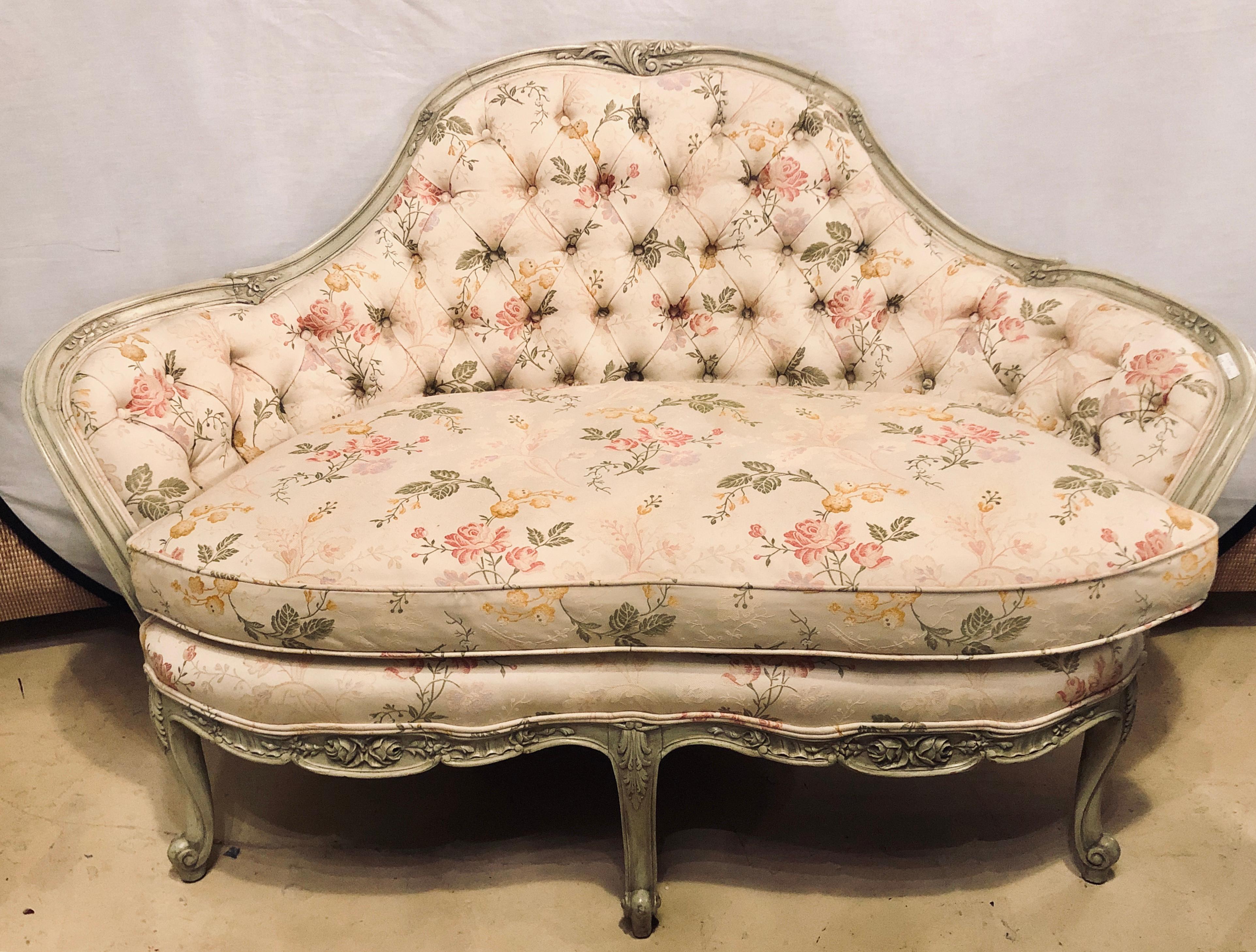 A French Louis XV style paint decorated settee tufted back with carved rosettes. A nicely carved settee or loveseat in the Swedish fashion.