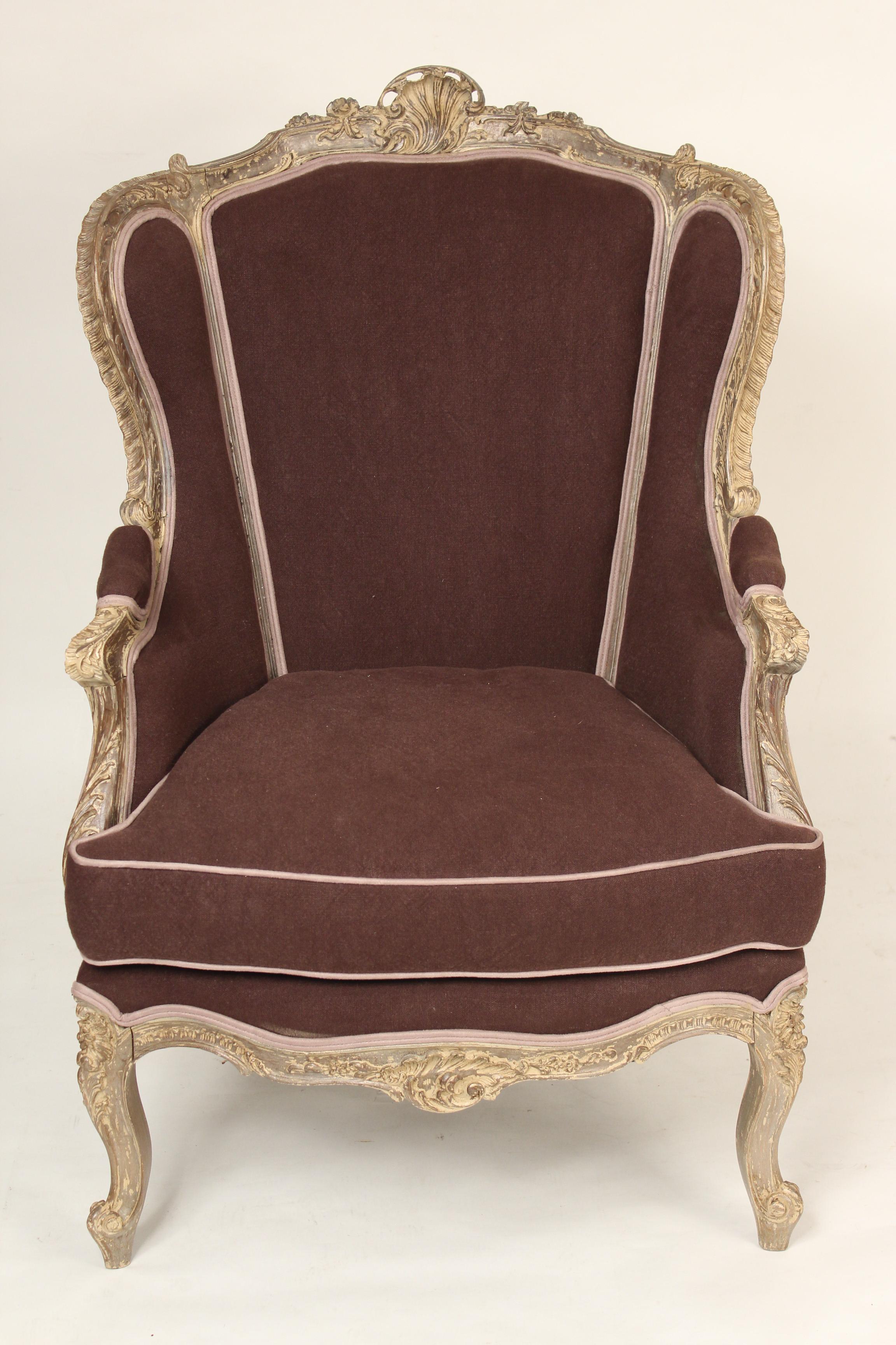 Louis XV style painted bergere, circa 1930. The finish is silver and cream colored paint.