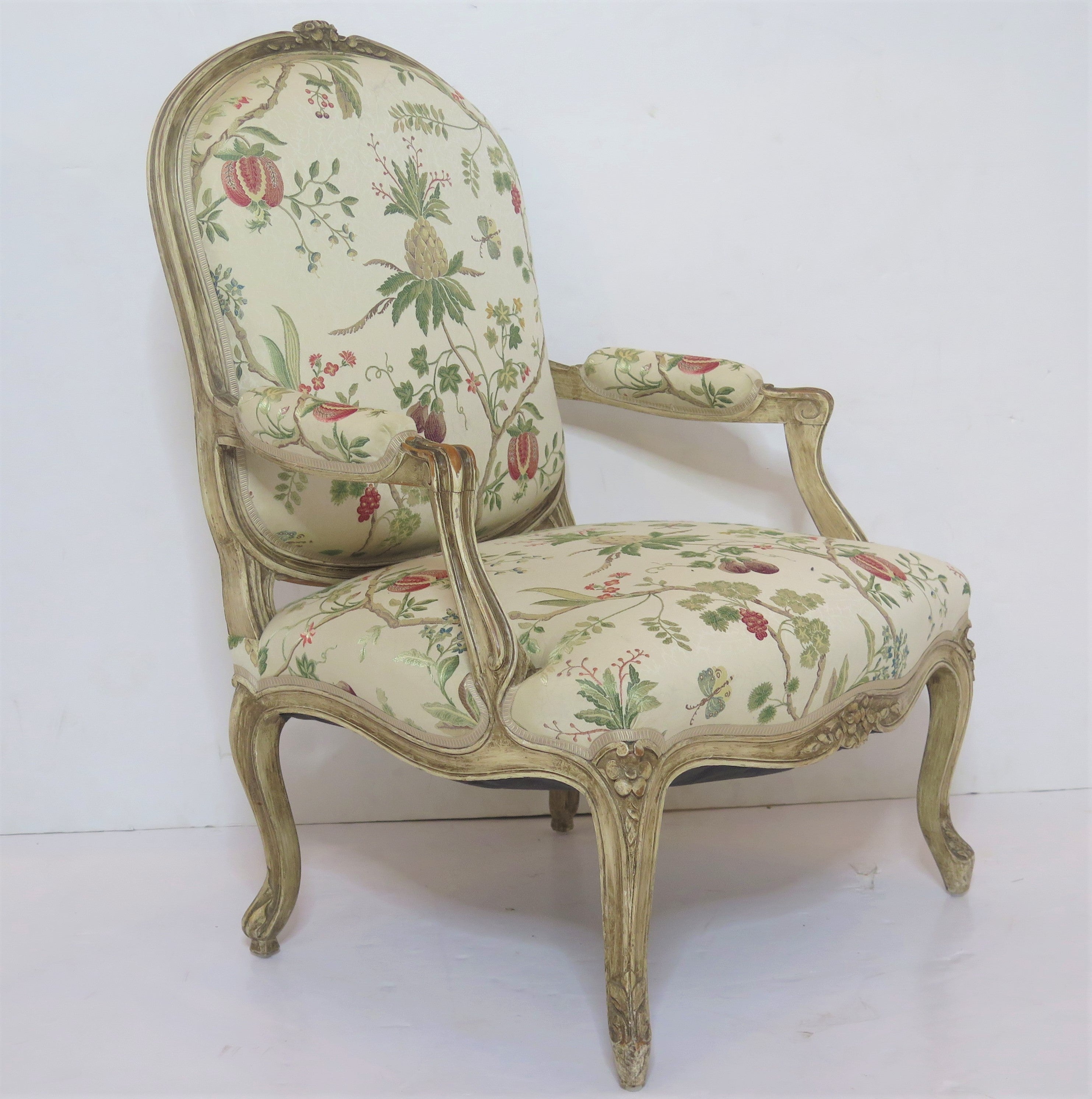 Louis XV-style painted fauteuil with Scalamandré fabric upholstery, pattern La Perouse, multi on ivory (CL 0001 26148), featuring pineapples, pomegranates, and figs (exotic fruits), Italian fabric, France, early 20th century