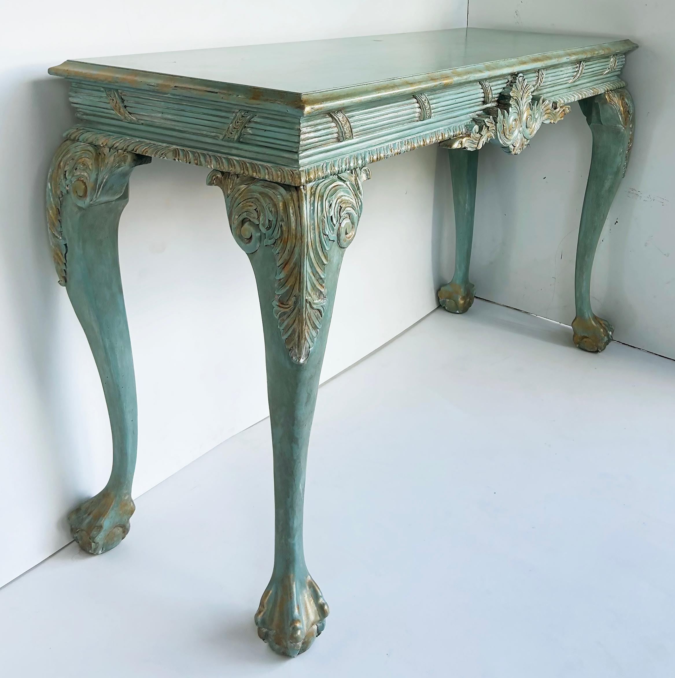 Louis XV Style Painted Gilt Console Table with Ball and Claw Feet

Offered for sale is a Louis XV style painted console table with lovely carvings and ball and claw feet and distressed-look gilt accents.  This console was an estate sale where it had