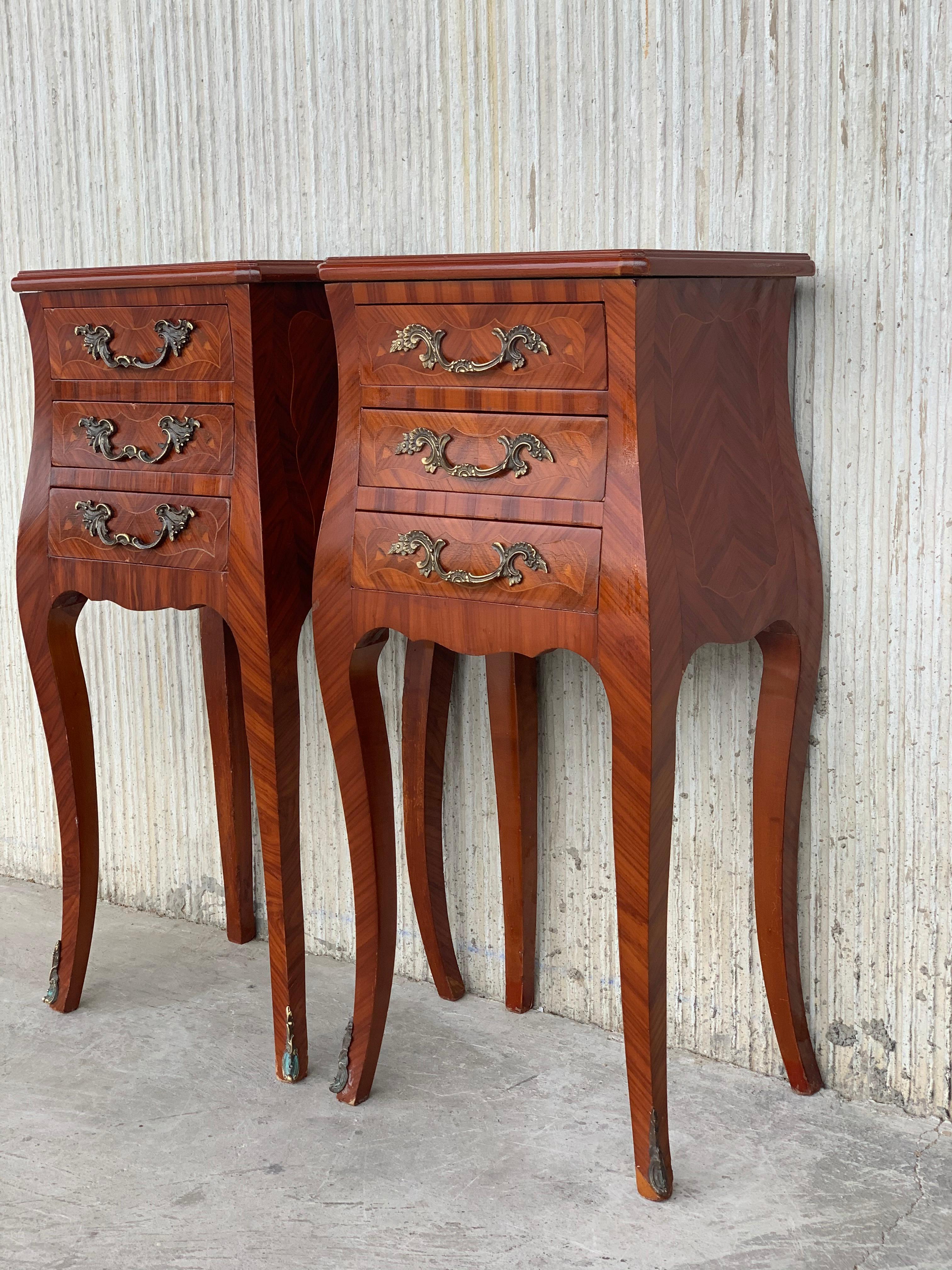 Louis XV style pair of marquetry nightstands with three drawers and cabriole legs.