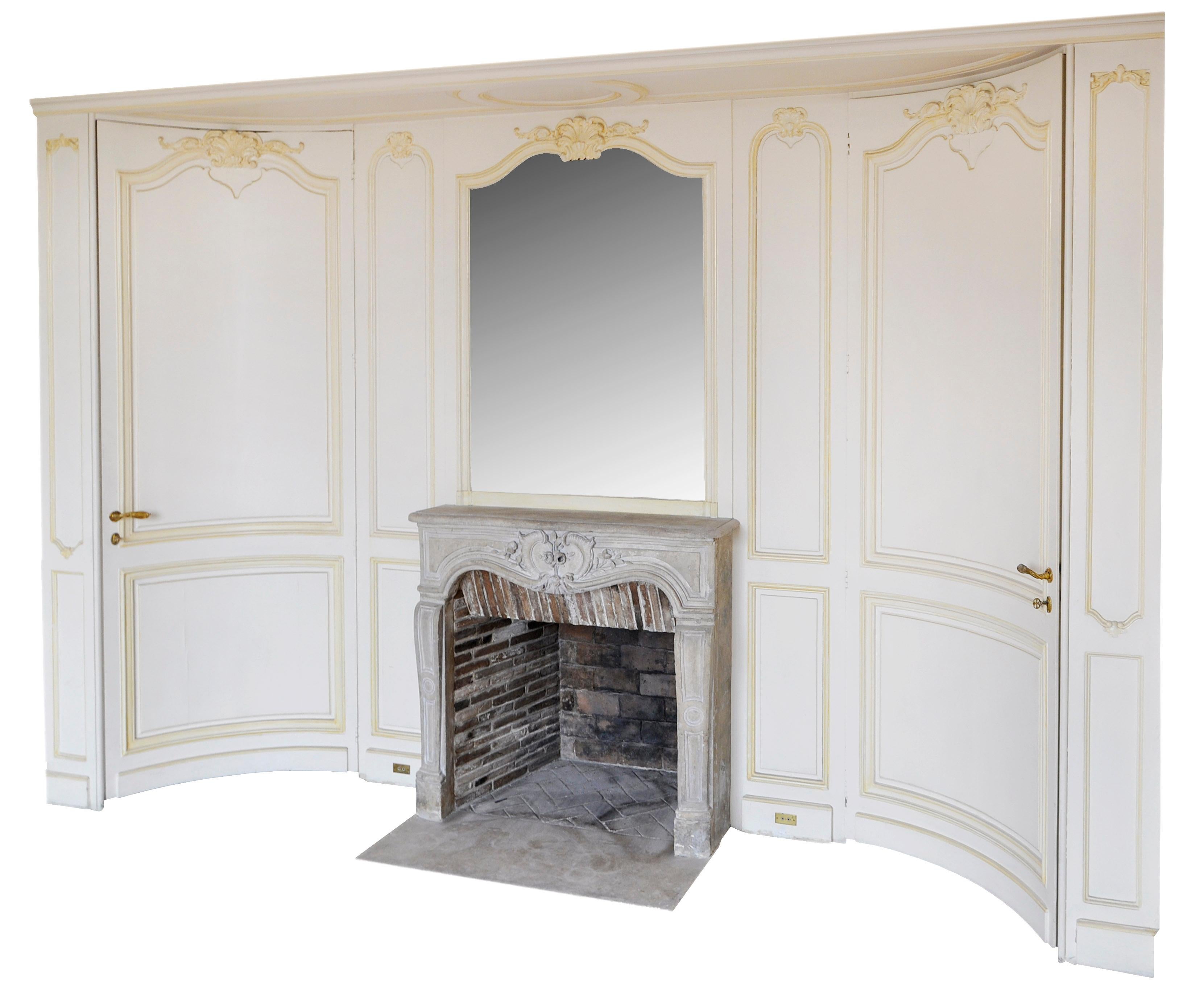 This Louis XV style paneled room was made in the early 20th century. The Louis XV era stone fireplace was made in the 18th century. The woodwork may be likened to the work of Jansen.

The paneled room was made out of carved wood. The fireplace comes