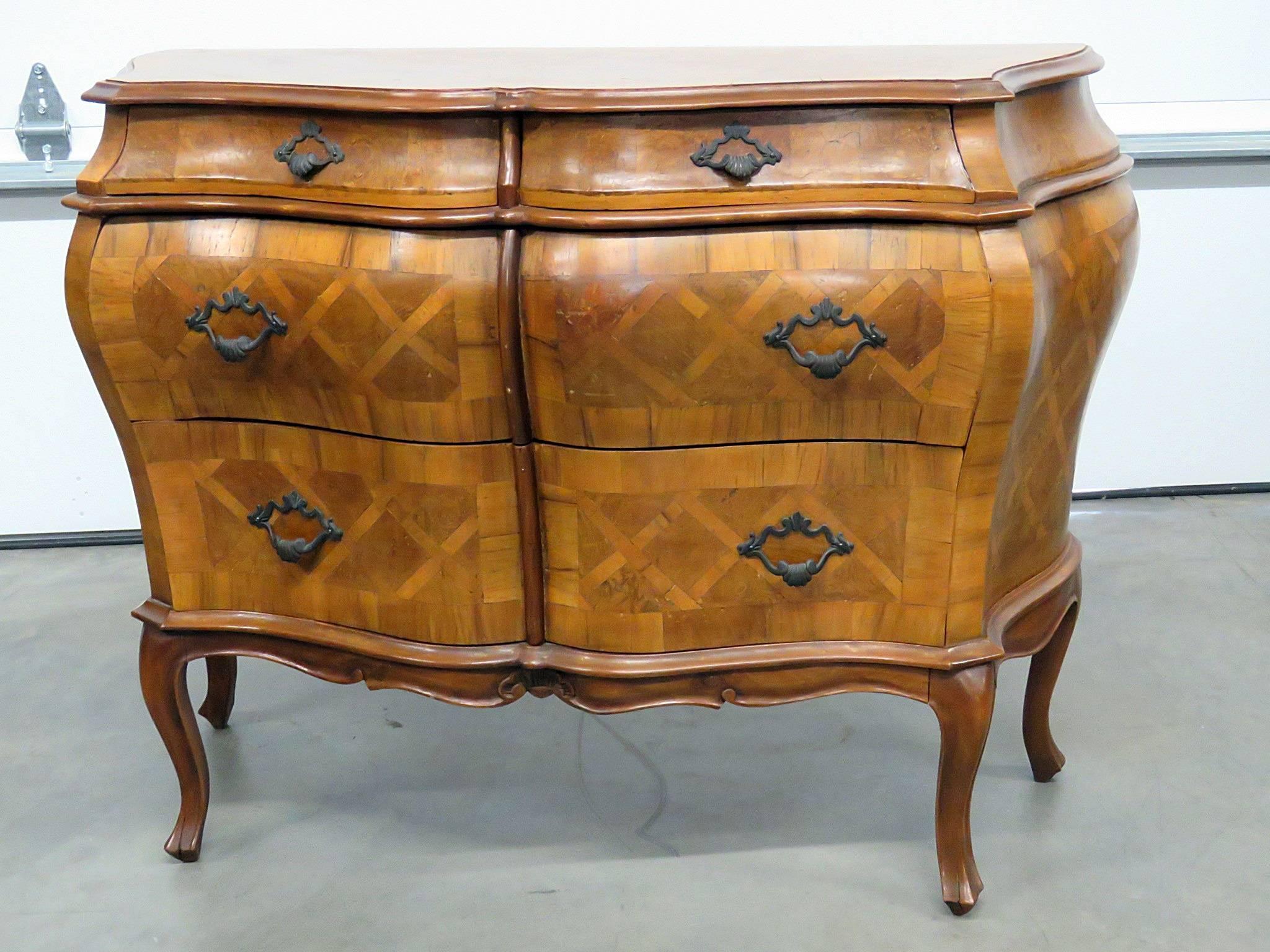 Louis XV style inlaid parquetry commode with four drawers.