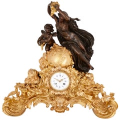 Antique Louis XV Style Patinated and Gilt Bronze Mantel Clock
