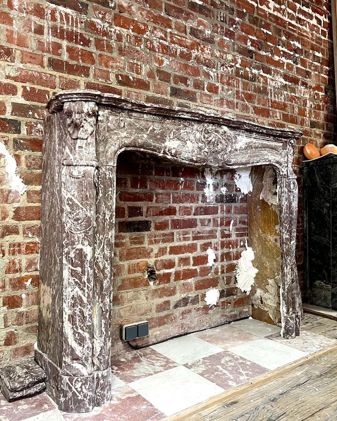 Late 19th Century Louis XV Style Red Marble Fireplace with Shell Motif, circa 19th Century For Sale