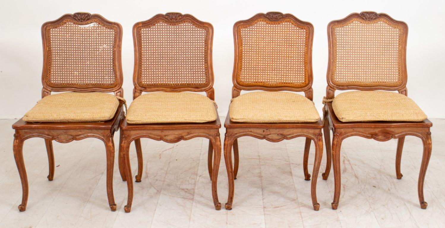 Louis XV style set of caned beechwood chairs, two arm chairs and four sides, with carved crest rail above square caned back and seats above four cabriole legs.

Dealer: S138XX