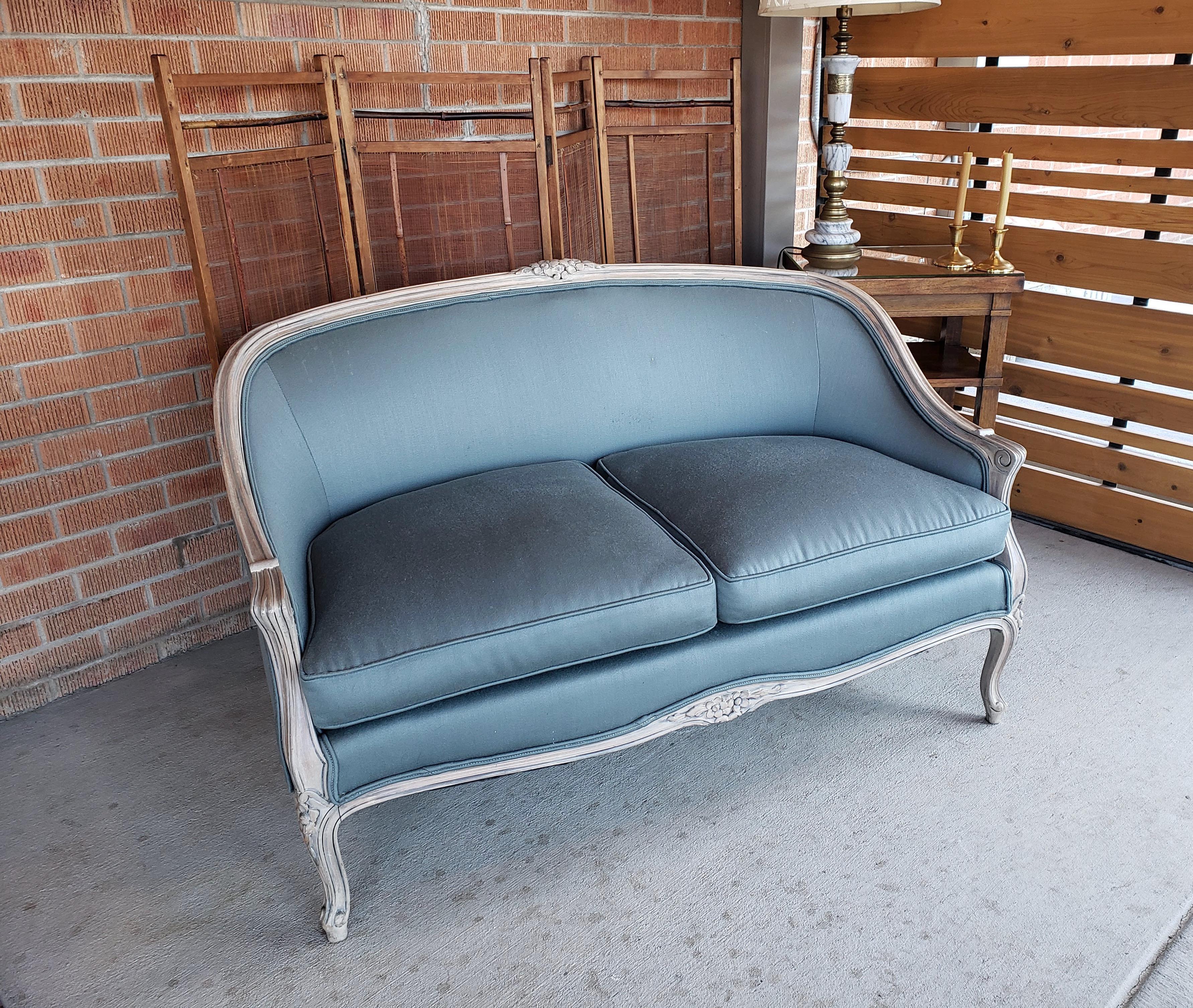 Handsome Louis XV style settee with a distressed painted wooden frame. The original cotton fabric is an interesting blue grey color. The settee is in good vintage condition, the seat cushion shows wear, please see photos.

 Most likely made in the