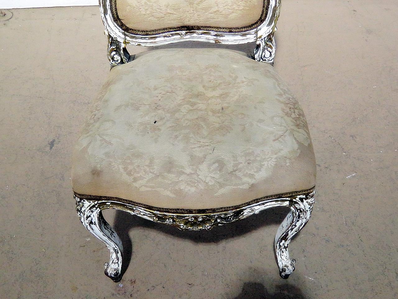 Louis XV style distressed painted side chair with gilt accents.