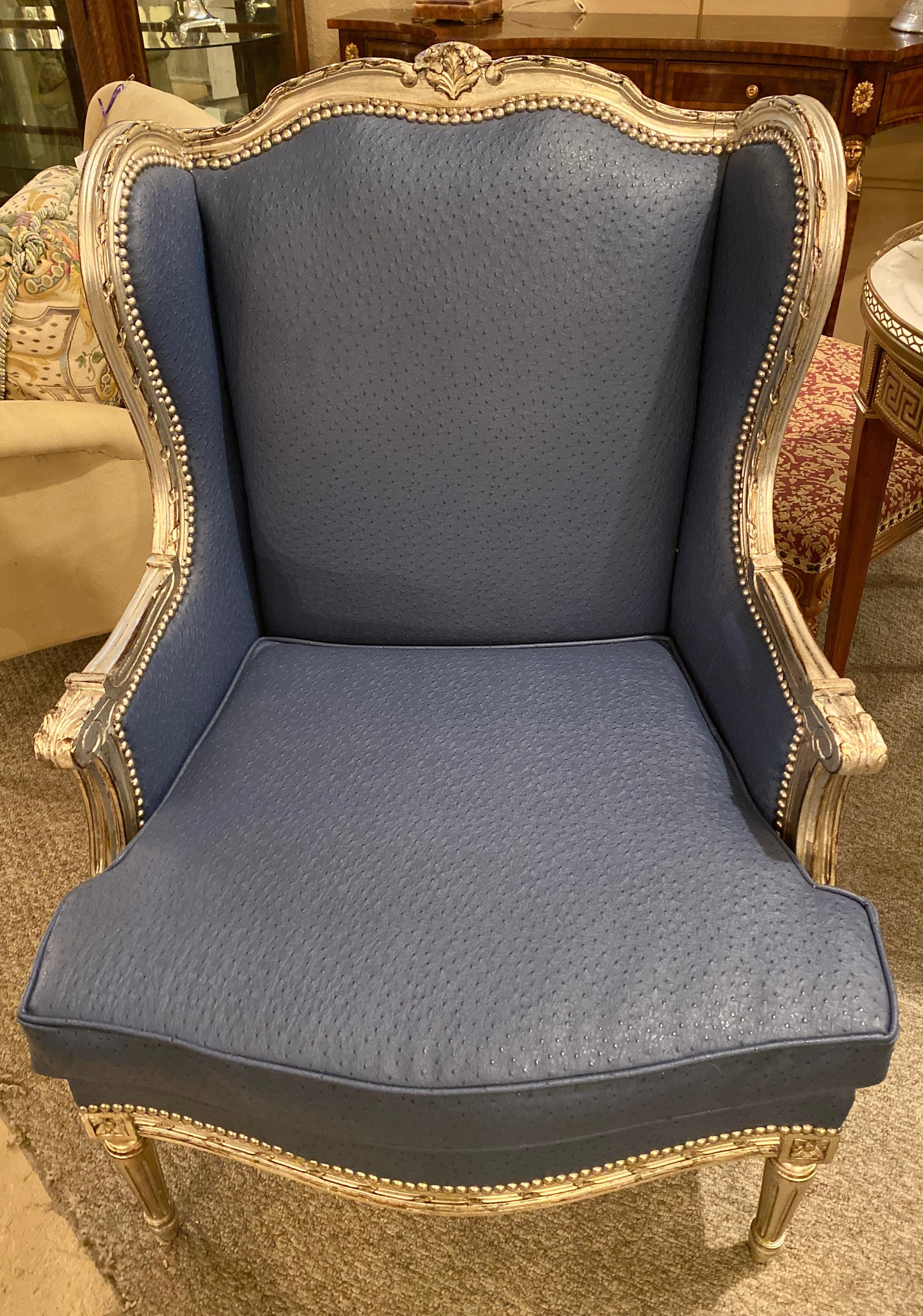 Louis XV style silver gilt wing back or bergere chair in a fine custom faux blue Ostrich upholstery. The frame on this early chair having been fully re-silvered and the material is new.
1XA.
 