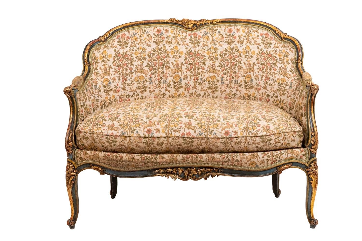 Louis XV style sofa in green lacquer and giltwood standing on four cabriole legs adorned with flowers. Scalloped apron decorated with flowers in its center. Full molded arms with manchettes on the leg line. Scalloped shape back mount adorned with