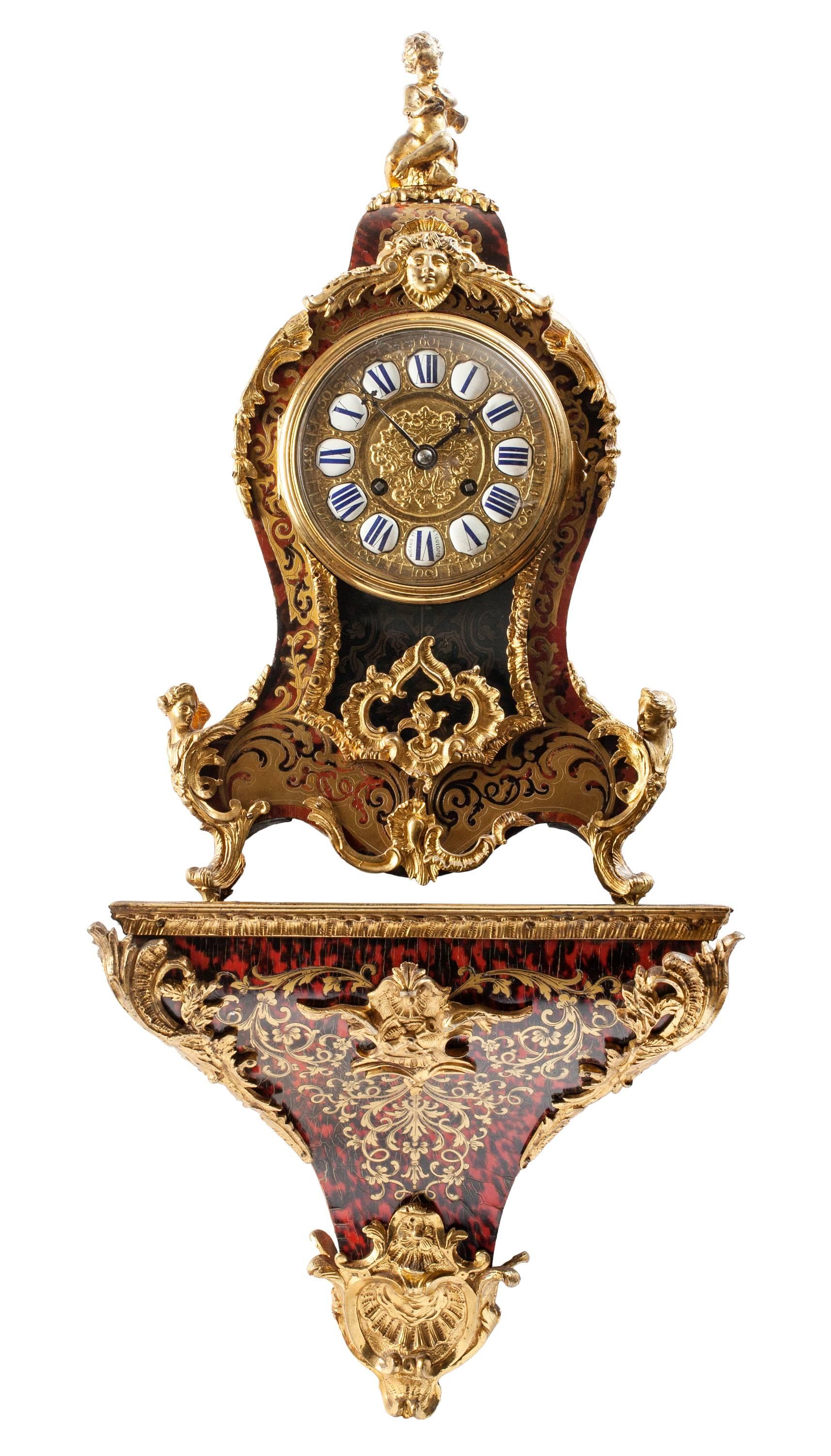 Opulent Louis XV style Boulle mantel clock, with matching shelf. Extravagantly decorated in red tortoiseshell and ormolu, with brass gilt face and enamel numbers, marked 