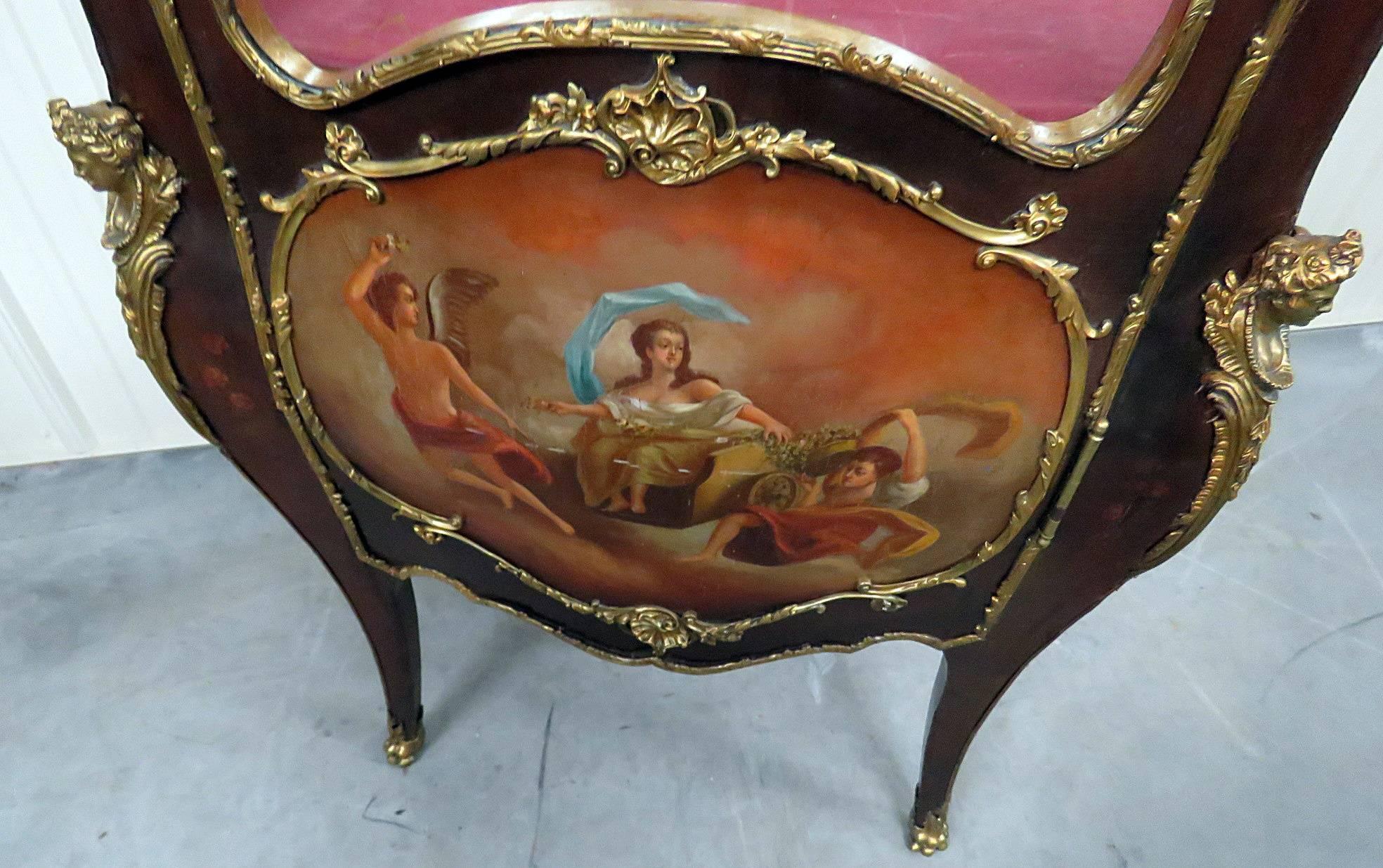 This is a fine quality Rococo 19th century Louis XV style vitrine with bronze mounts in the manner of Linke. The paint decoration is beautifully handled and has an antique crackeled finish that only time provides. This is one of the more romantic