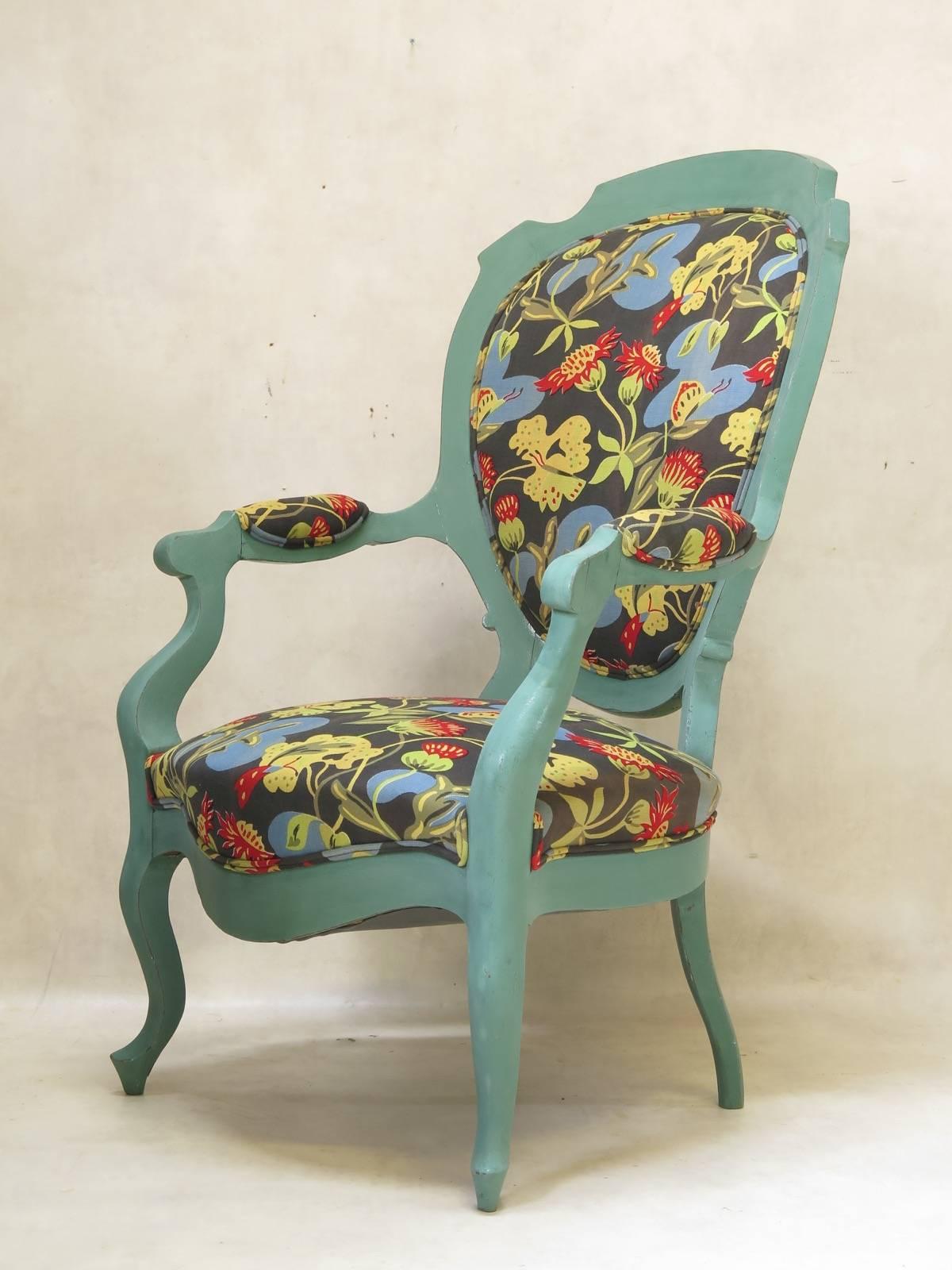 Unusual Louis XV Voltaire armchair, with a large medallion back, and cabriole legs; painted bluey-green, and upholstered with a colourful, vintage 1930s Art Deco fabric.