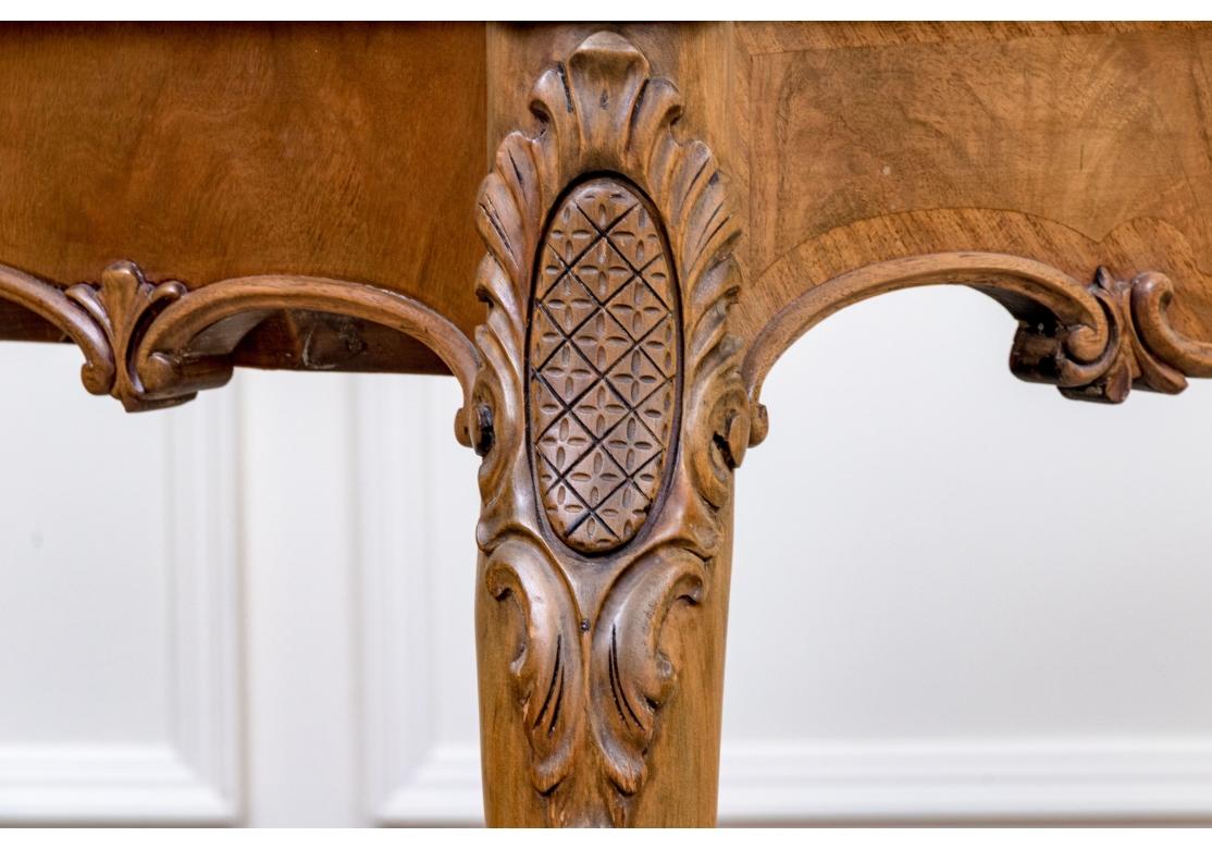 A particularly decorative French style Console Table that once had the ability to double the top size with a flip top feature which is no longer working, the piece is being sold solely as a console. . Raised on cabriole form legs terminating on well