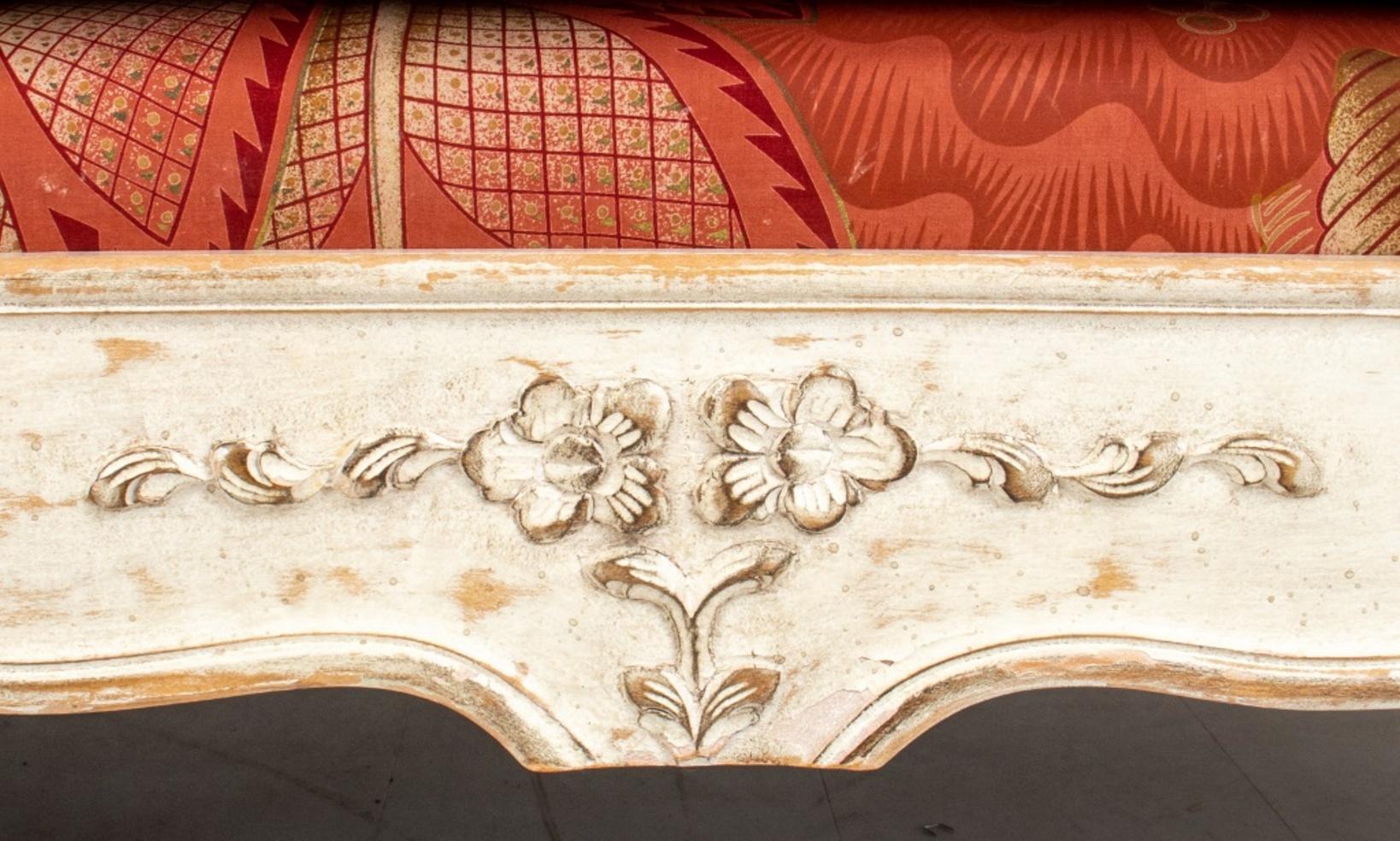 Louis XV Style White-Painted Caned Bed,  with scrolling head and foot, with caned panels and carved rails on cabriole feet.

Dimensions: 35