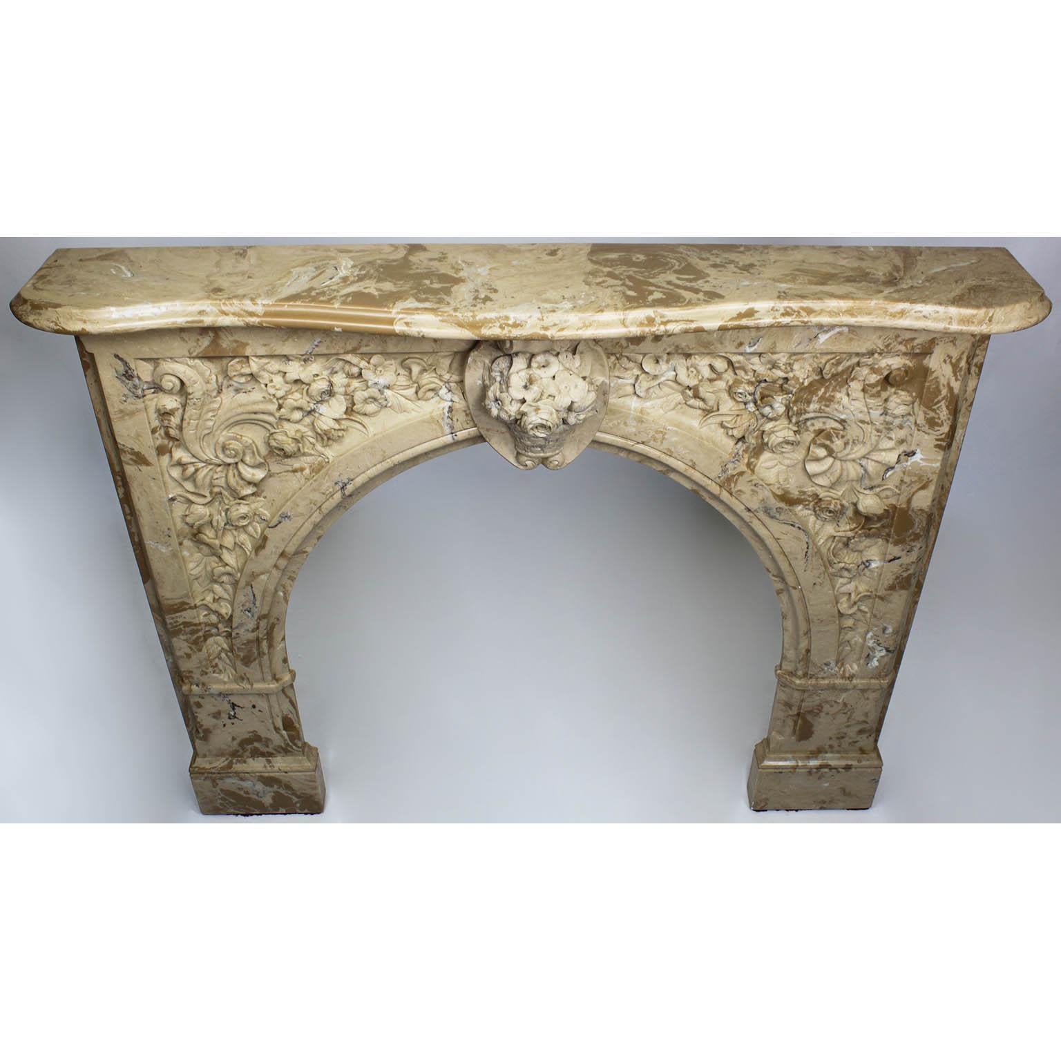 A Louis XV style white and veined beige-brown color cultured cast-marble fireplace mantel. The ornately detailed mantel centered with a basket of flowers flanked by floral and shell themes, circa 20th century.

Measures: Shelf width 59 inches