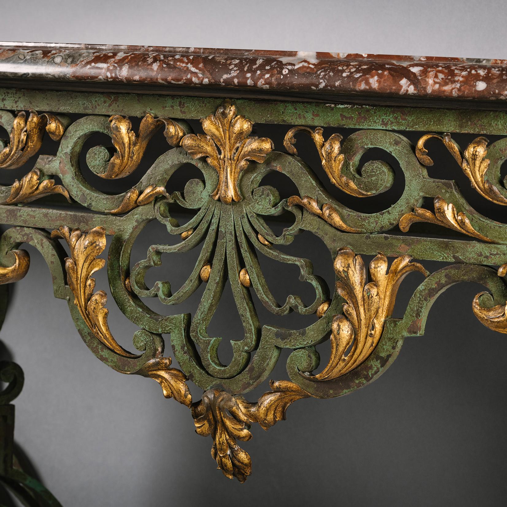 A fine Louis XV style wrought iron and gilt console d'Applique with a rouge de Rance marble top.

French, Circa 1890.