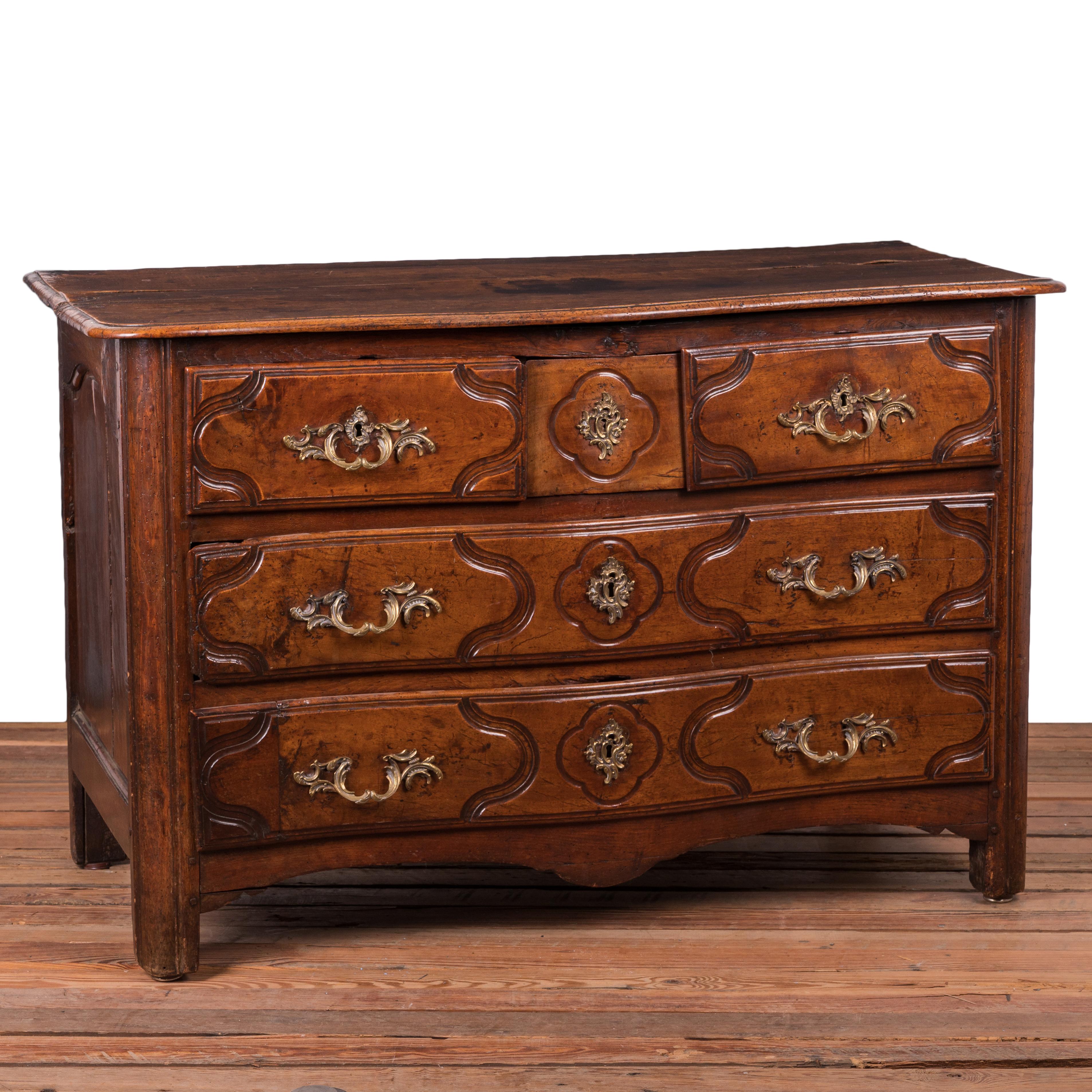 A Louis XV carved walnut commode, 18th Century.

Five drawers with three smaller drawers including a hidden drawer over two large drawers.

Provenance: Estate of T. Boone Pickens (J. Garrett Auctioneers, September 13, 2020)

49 ½ inches wide by 23